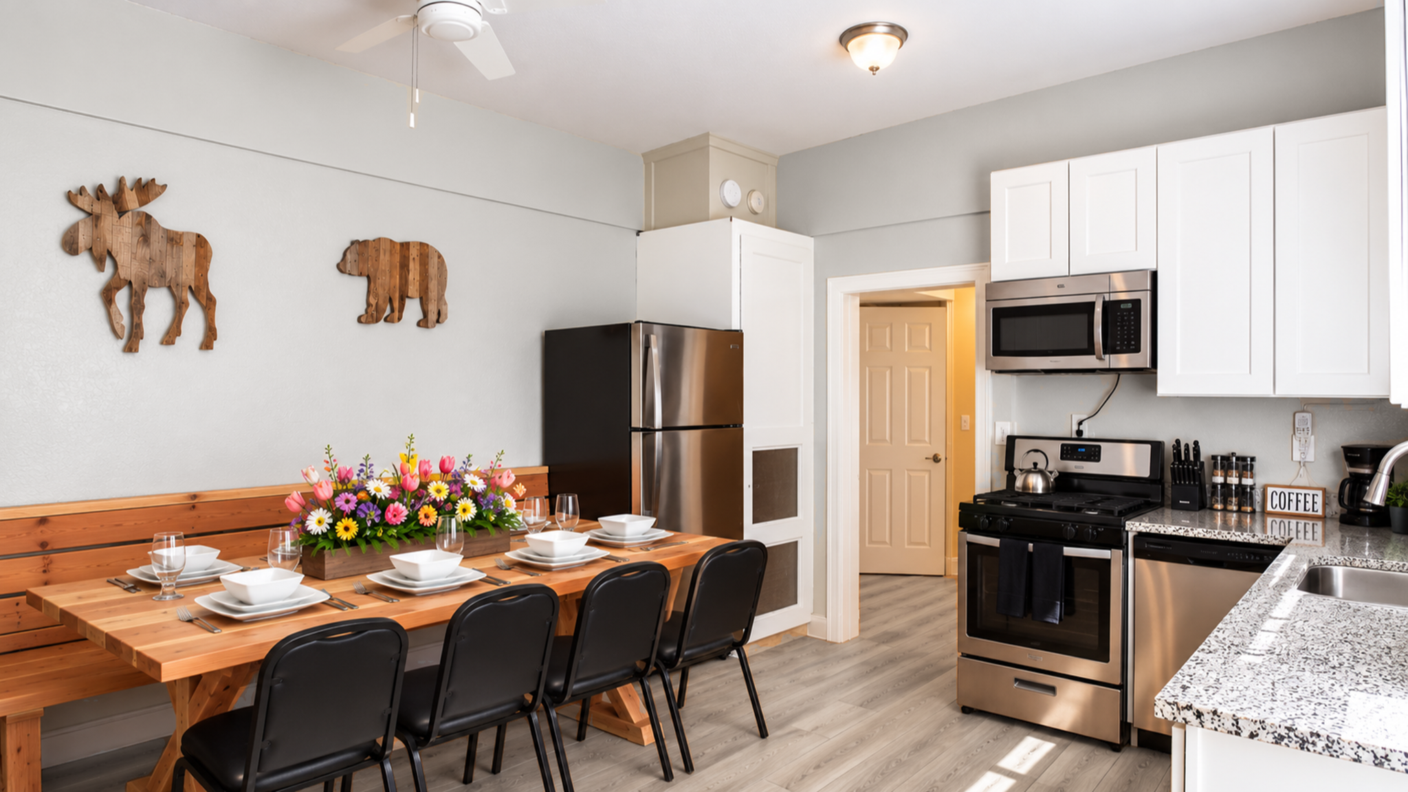 Bright kitchen with stainless appliances and cozy dining for the whole group