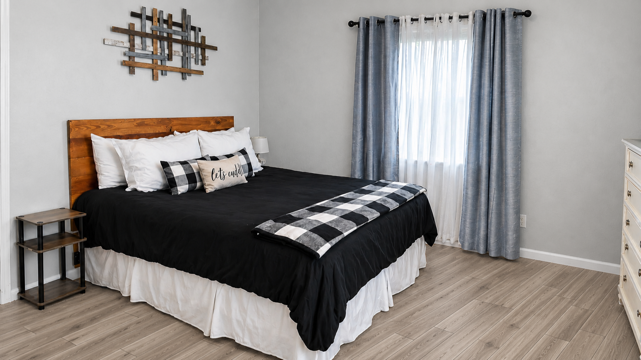 Bright, cozy bedroom with stylish decor and a spacious, modern feel