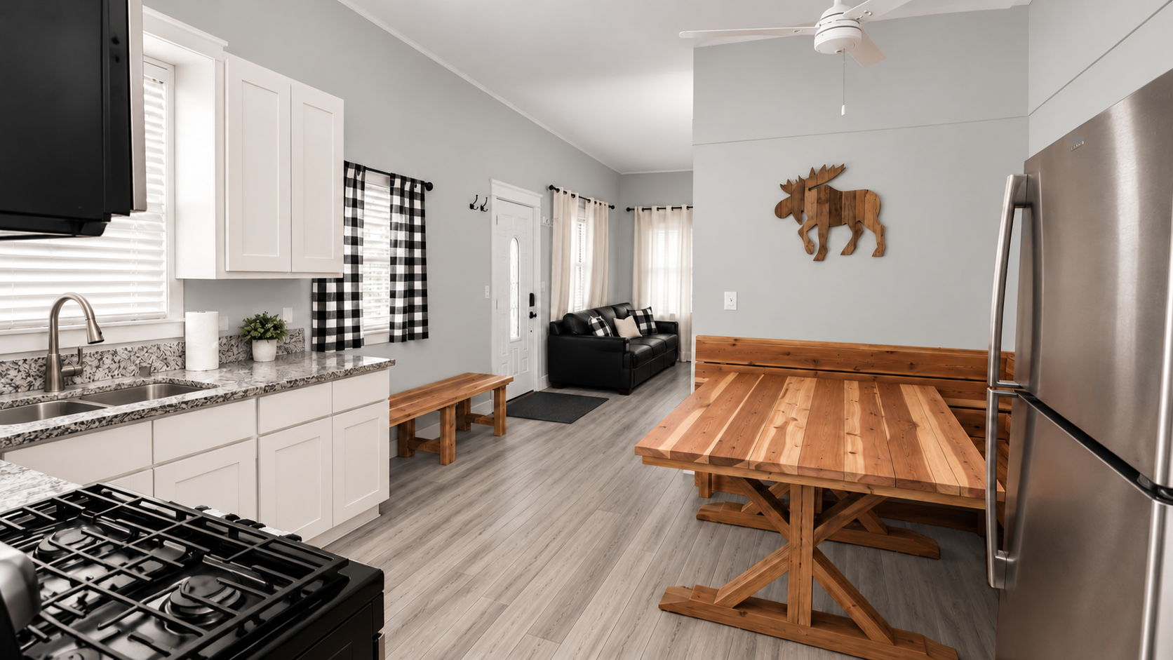 Bright modern kitchen with rustic dining table and inviting open layout