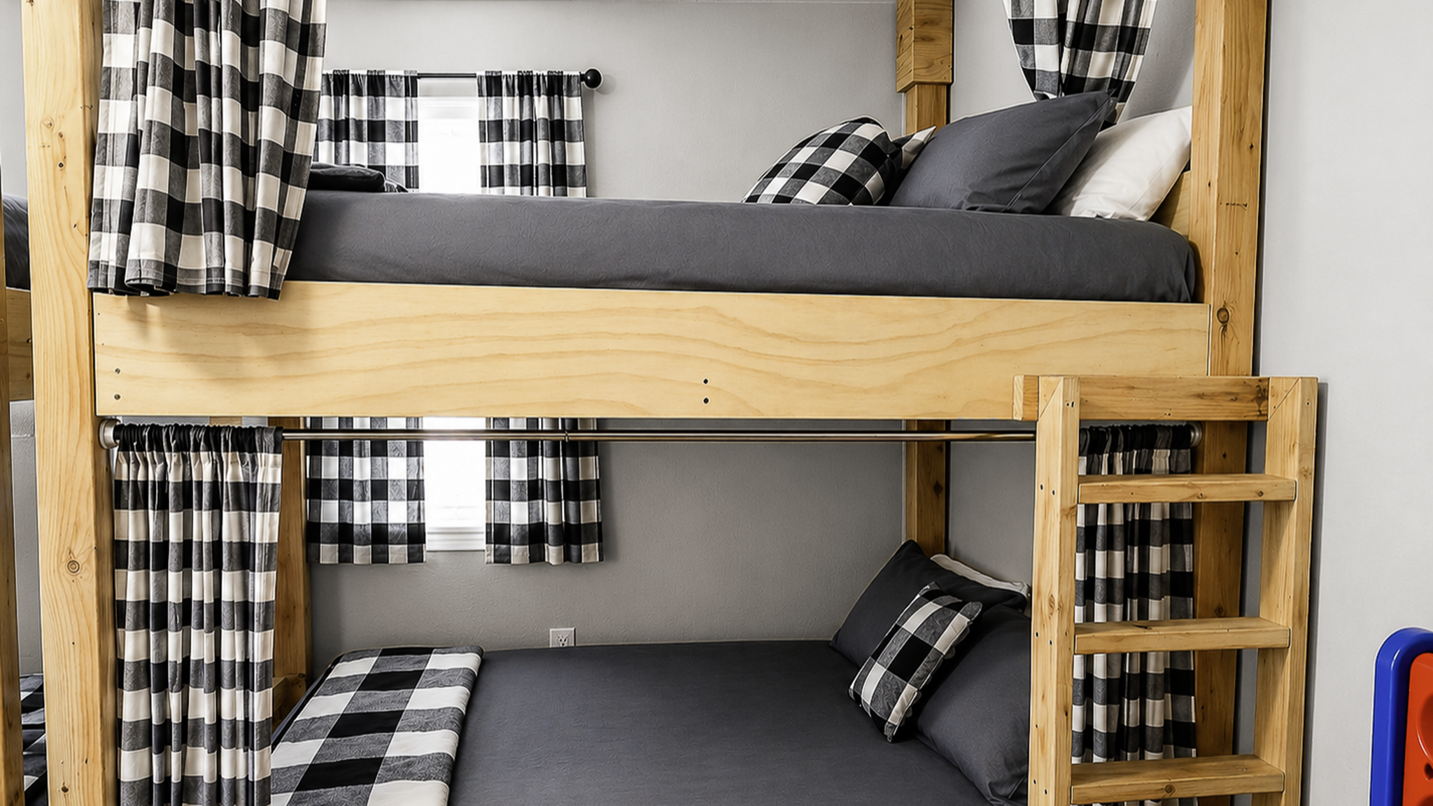 Cozy custom bunk room with full beds and stylish plaid privacy curtains