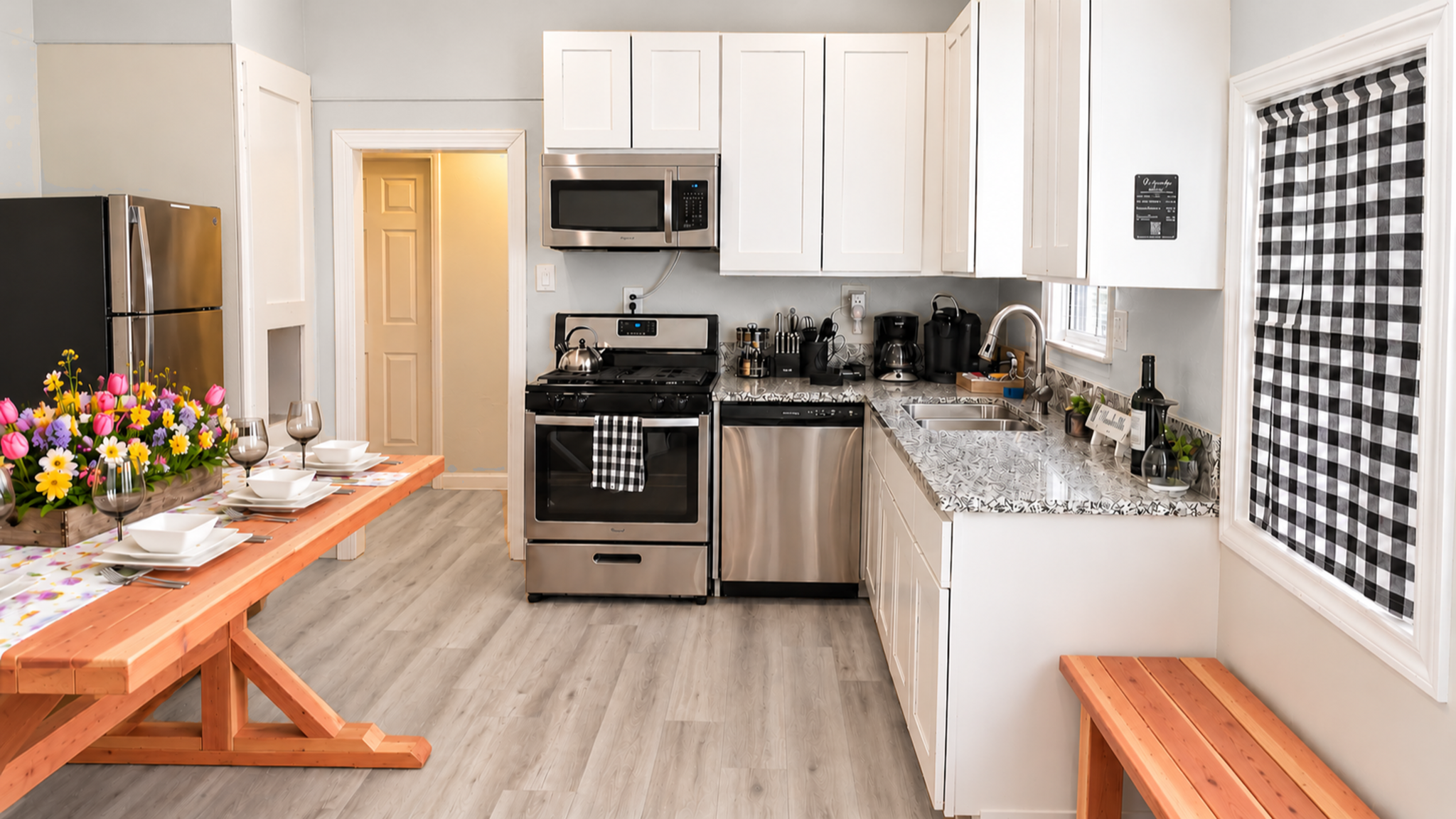 Bright modern kitchen with granite counters and cozy dining space