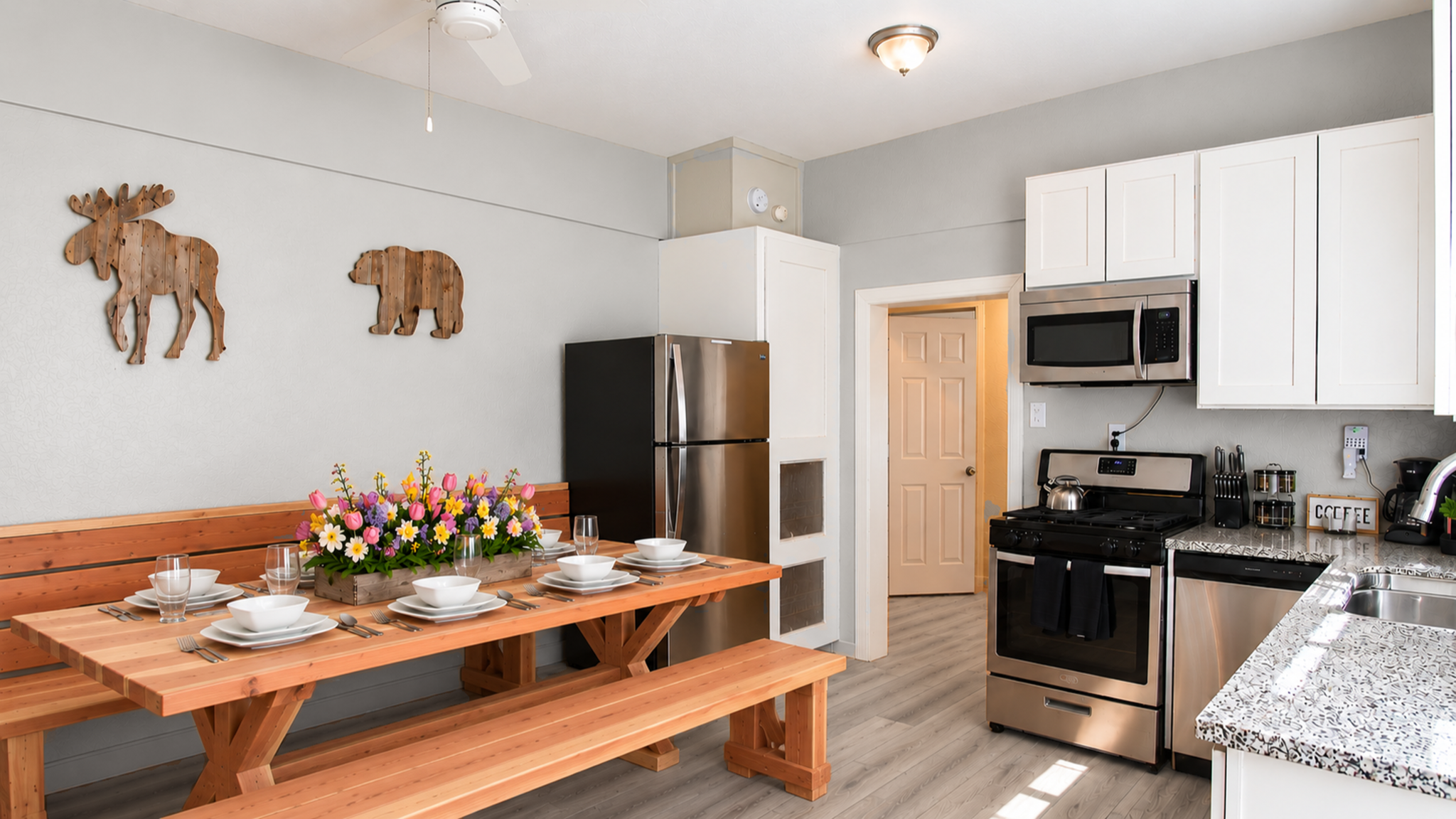 Bright farmhouse kitchen with granite counters and spacious dining table