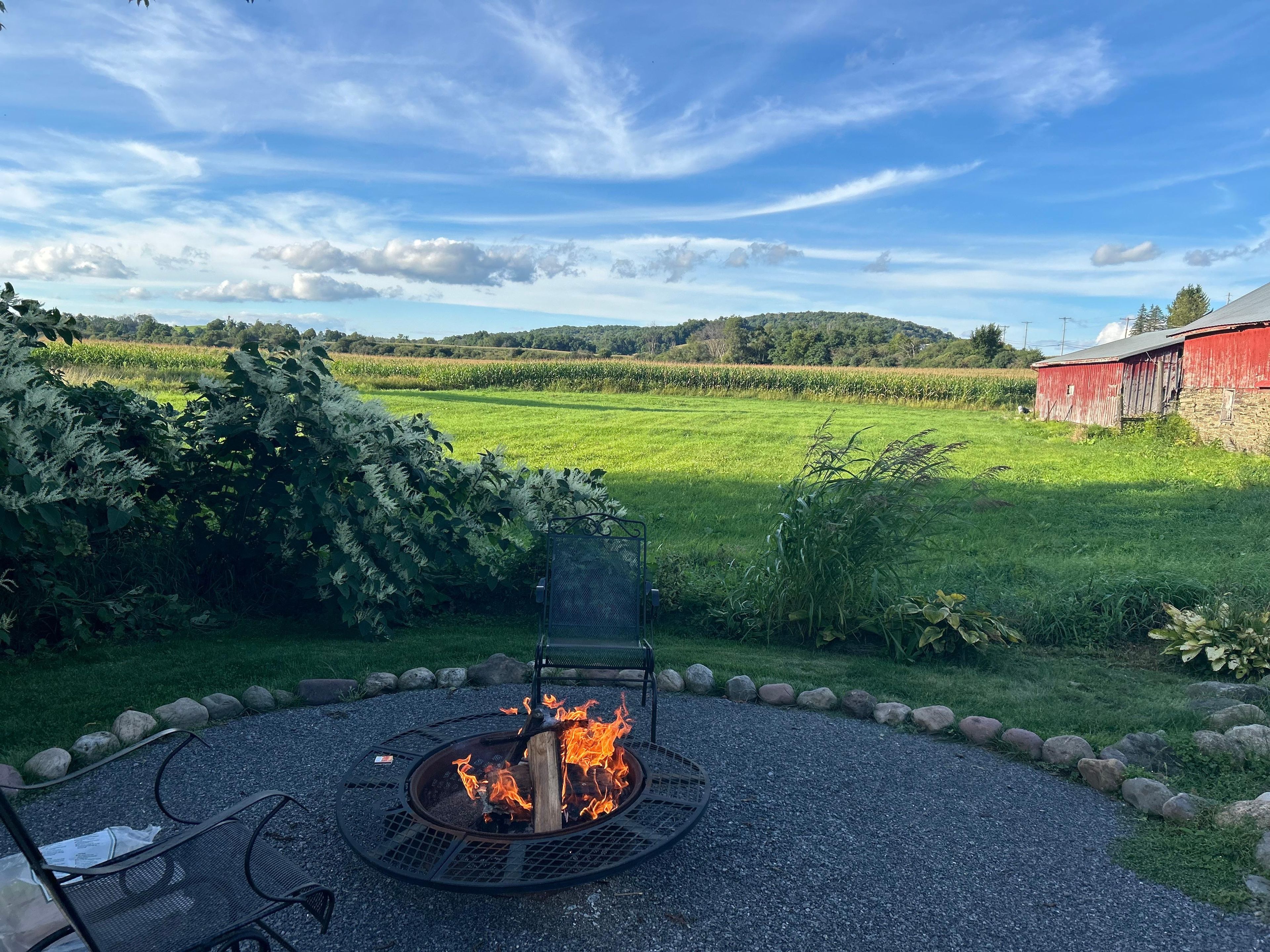 Sit around the fire pit and enjoy the idyllic view of our neighbor's farm!