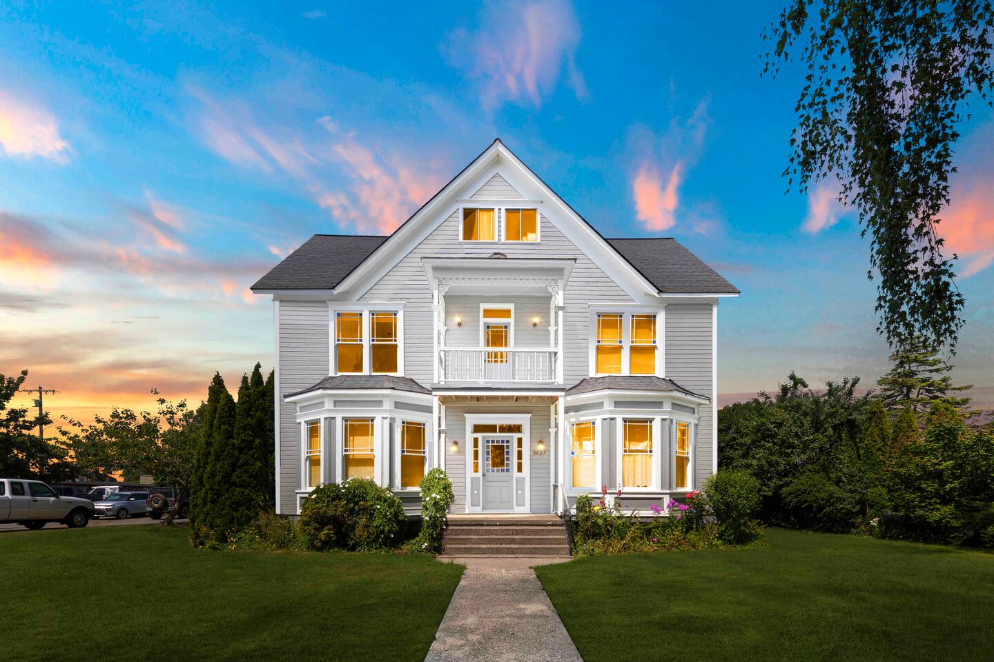 Nestled in a quiet neighborhood, this stunning Victorian home stands out with its classic architecture. The front porch, with its intricate woodwork and inviting design, is the perfect spot to enjoy your morning coffee.