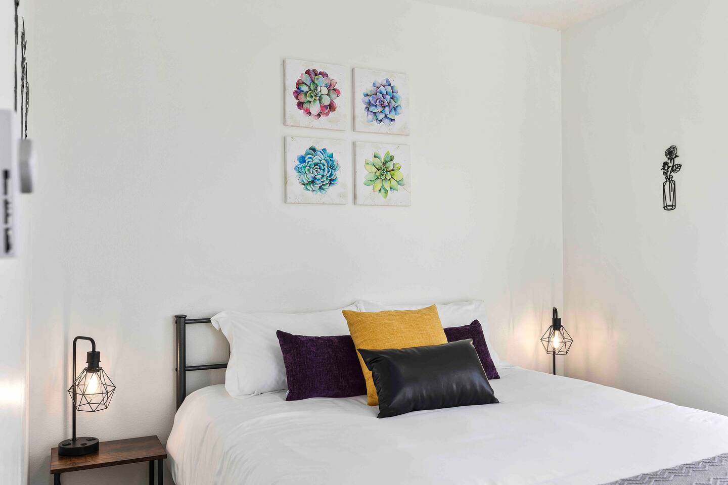 A serene escape with minimalist decor and cozy bedding. Large windows fill the room with natural light, making it a peaceful spot to rest and recharge. Simple yet elegant, this bedroom ensures a restful night’s sleep.