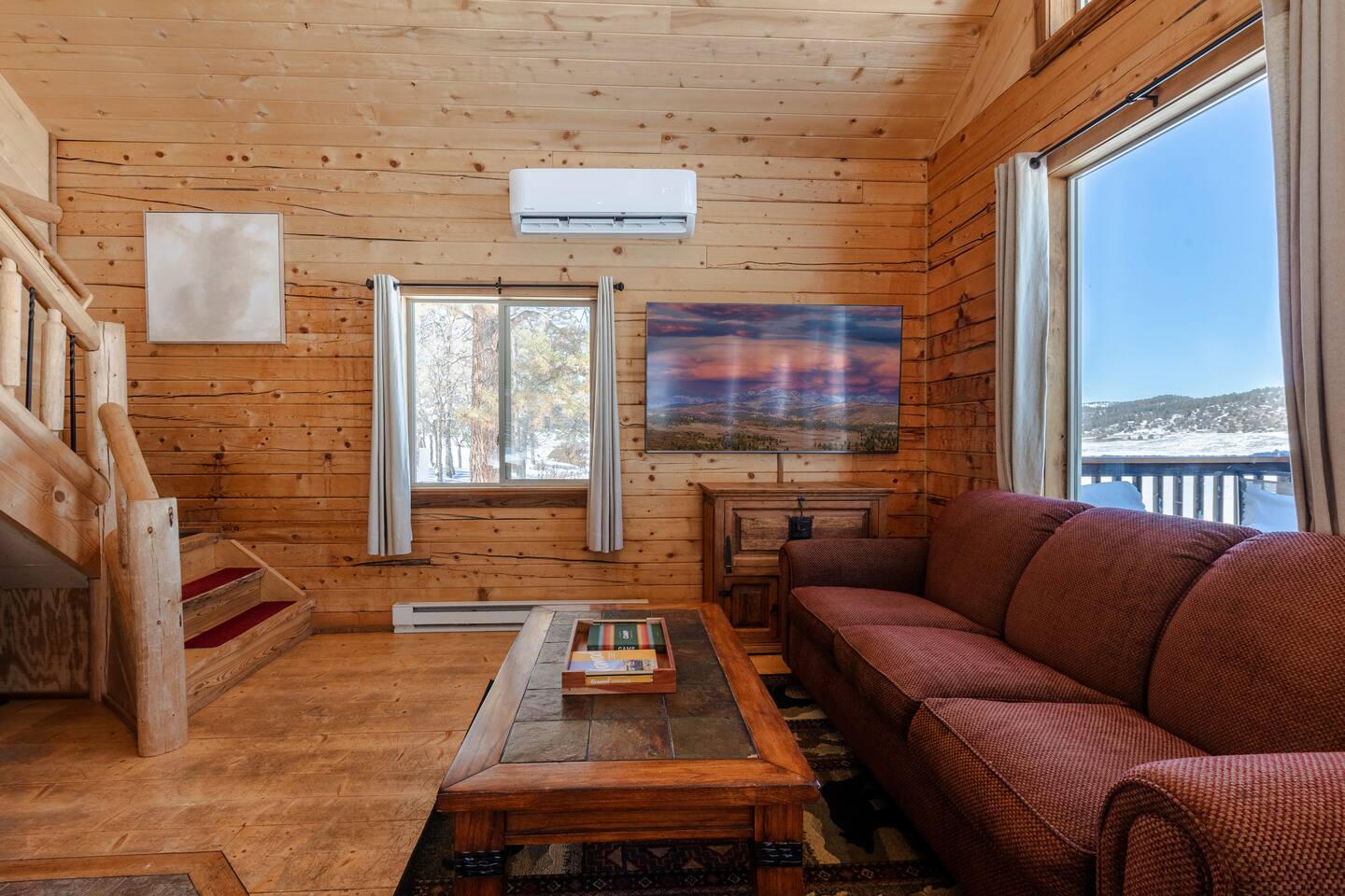 Relax and binge-watch a show or movie on the 70-inch 4K smart TV. Each TV in the house has an Amazon Fire Stick to access your favorite streaming services. But don't forget to look out the windows! Also, notice the modern AC/Heat Mini-Split unit!