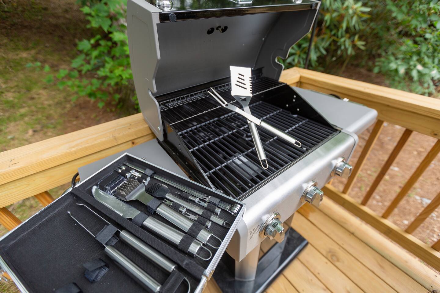 3 burner grill with provided grill tools.