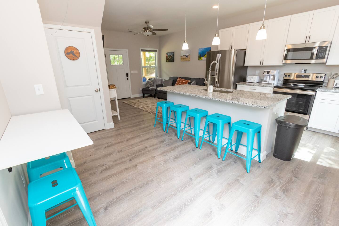 Dining room seating for 8 in a fully stocked kitchen.