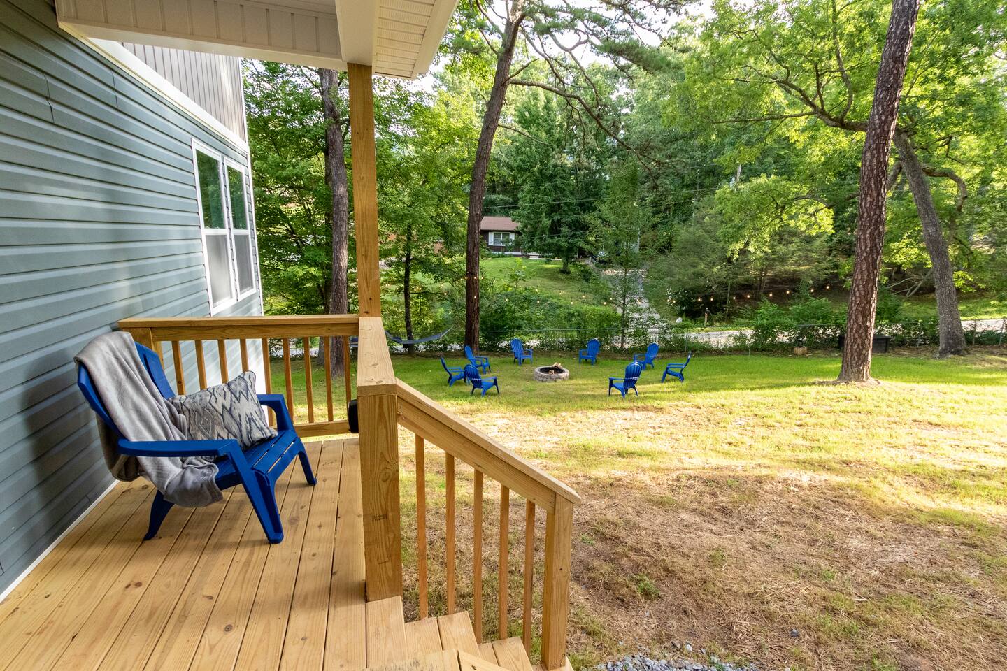 Enjoy some quiet time on the porch but still close enough to everyone at the firepit to be included.