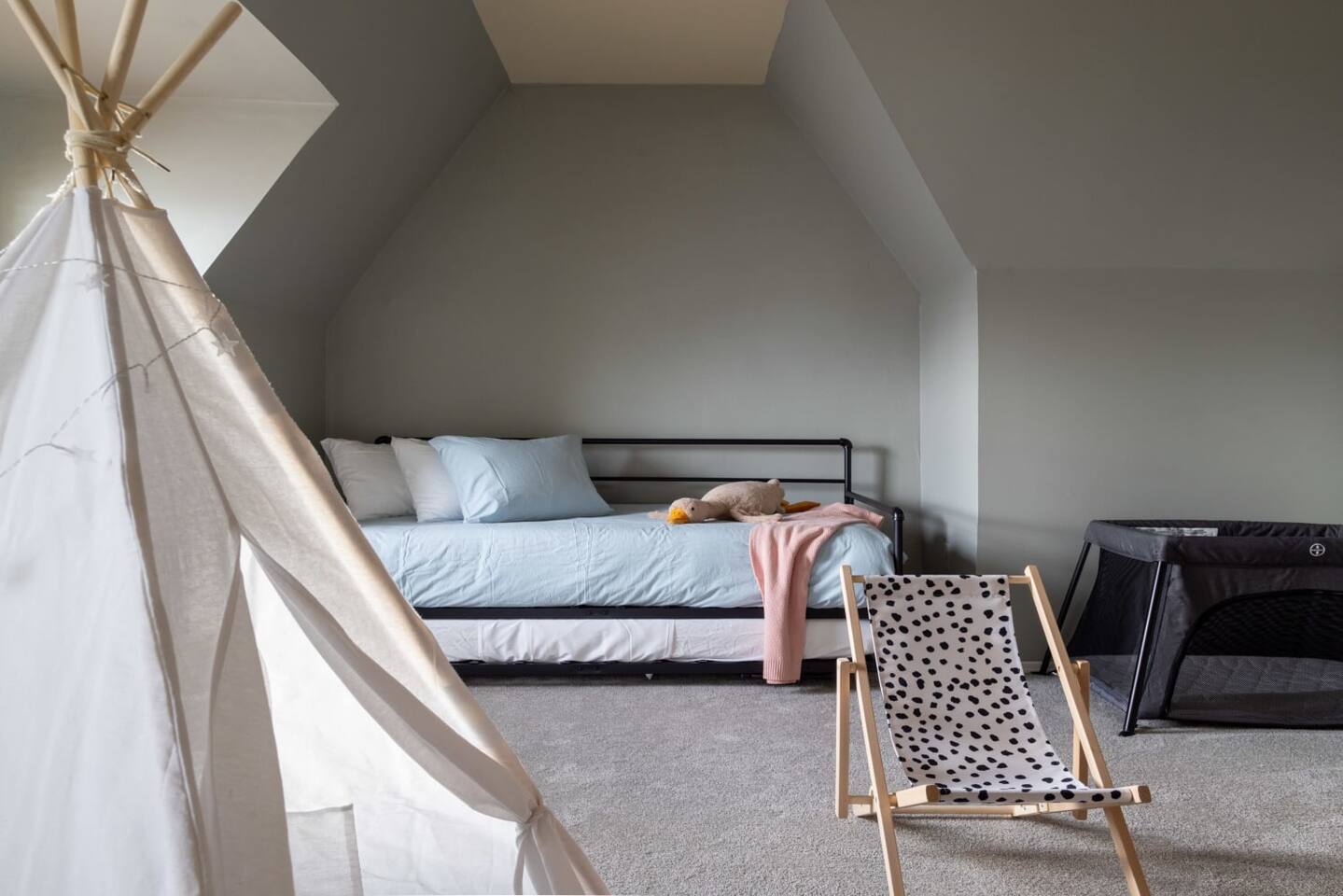 Trundle beds pull out for sleeping for 4 in this large bedroom!