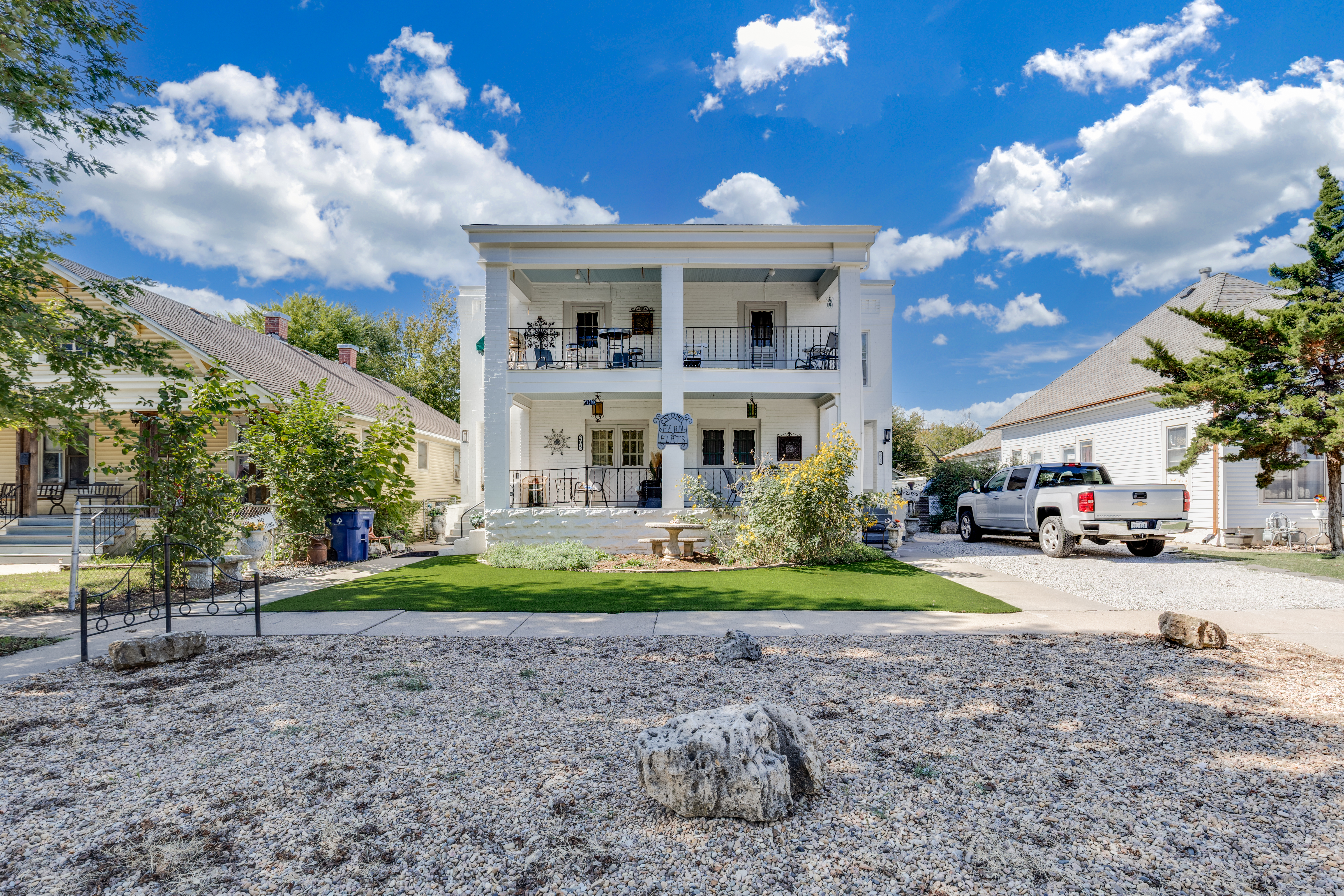 Grand columned home with double porches and inviting curb appeal