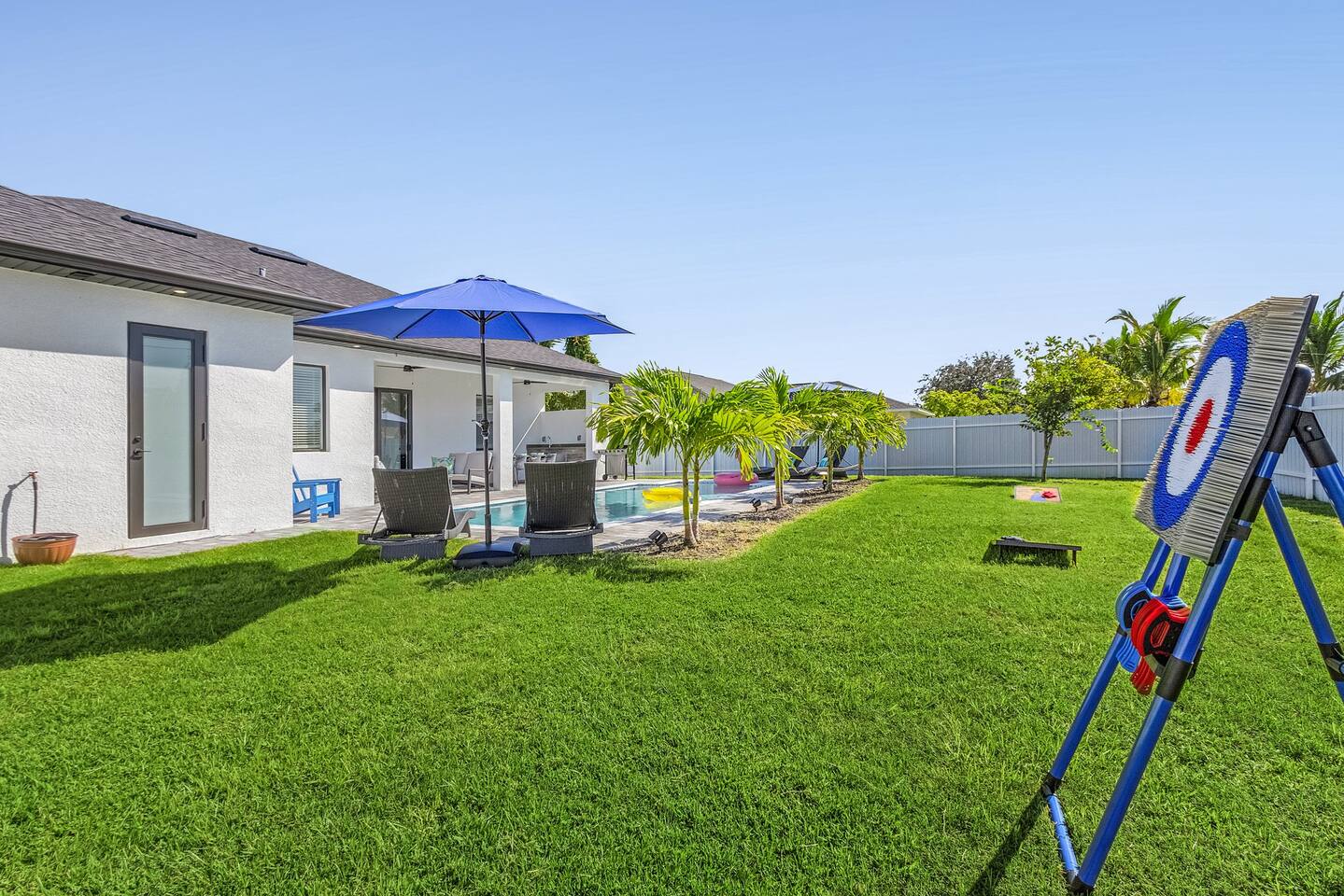 Backyard games including axe throwing and cornhole