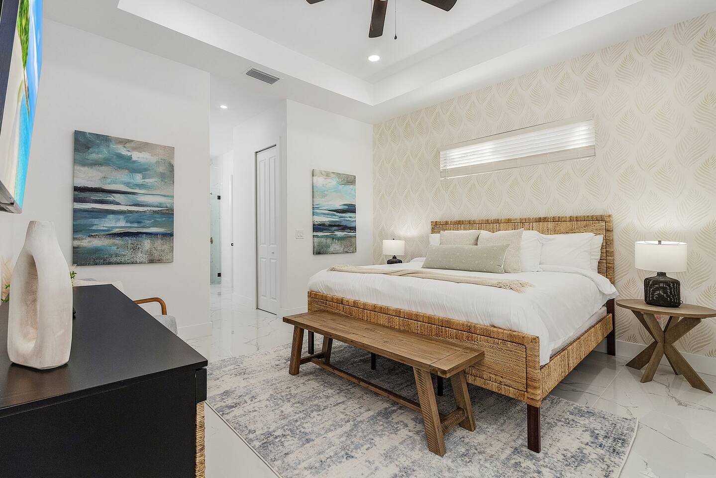 Luxurious master bedroom with a plush king bed