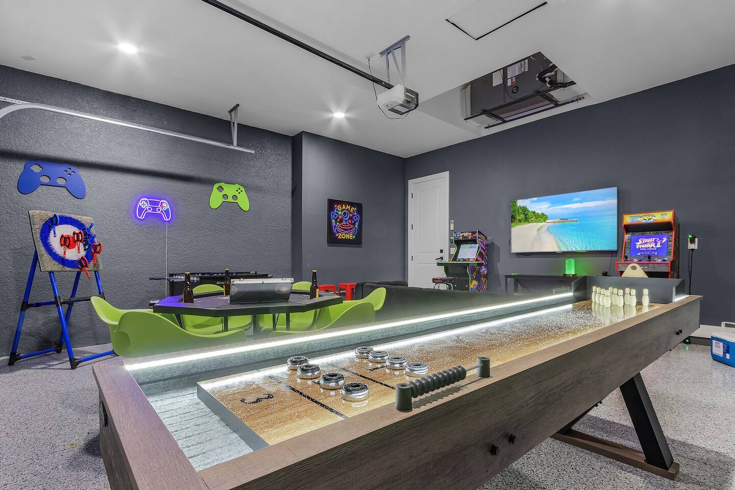Air-conditioned game room with LED foosball, shuffleboard, poker table and arcade games