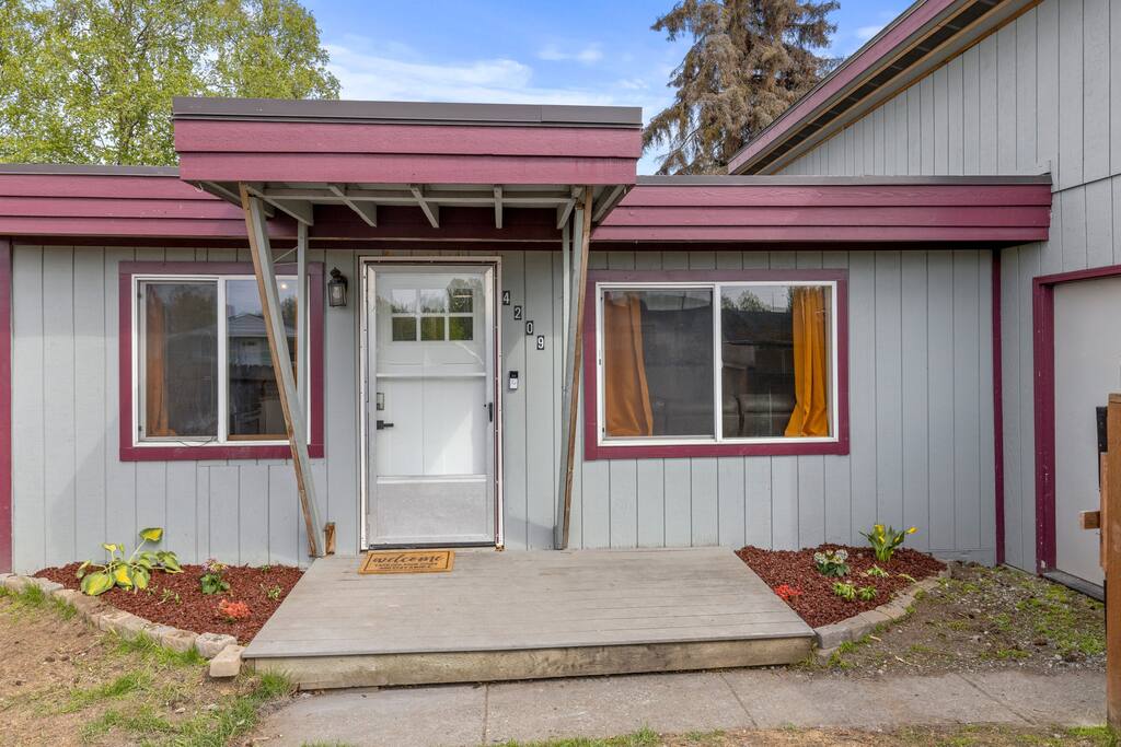 Funky 2 bedroom with fenced yard & heated garage!