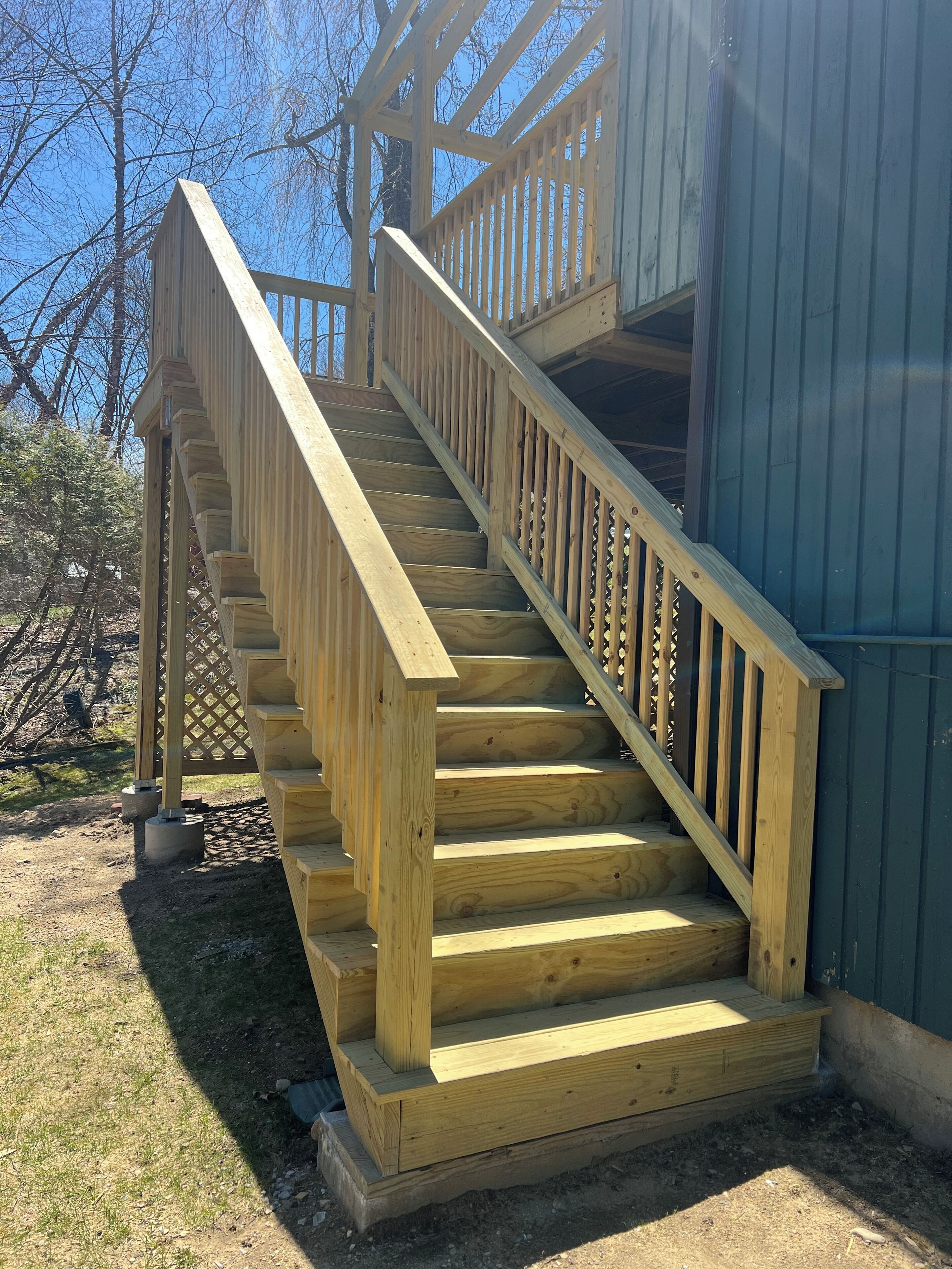 Stairs lead to the back yard