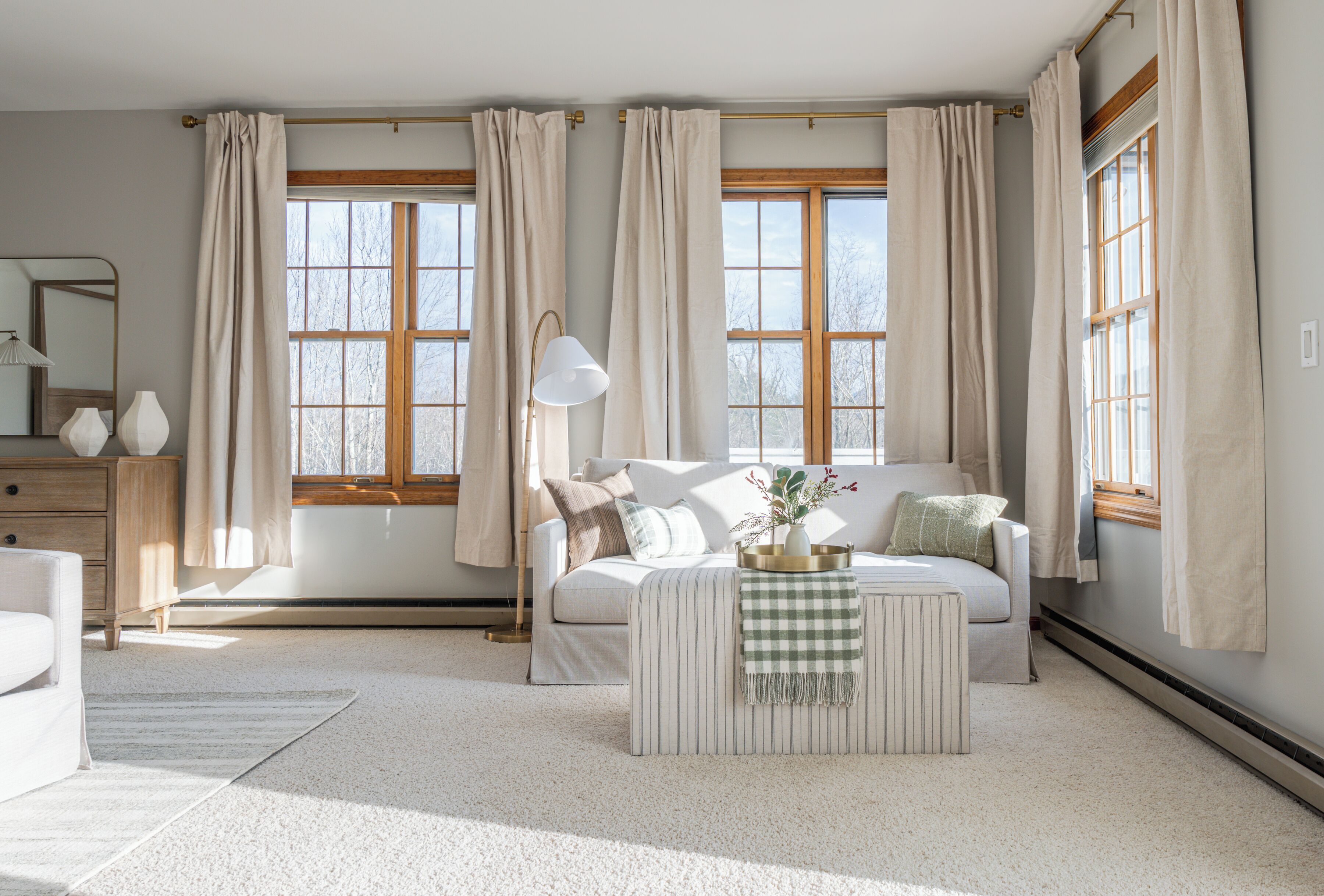 Sun-filled living room with serene views and soft, inviting style