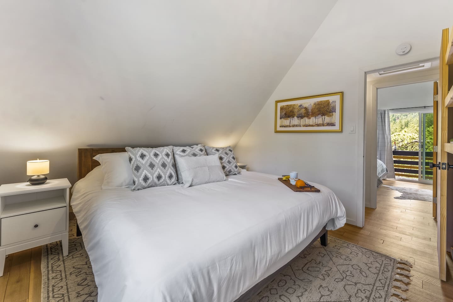 Second king bedroom with white bedding and a breakfast tray