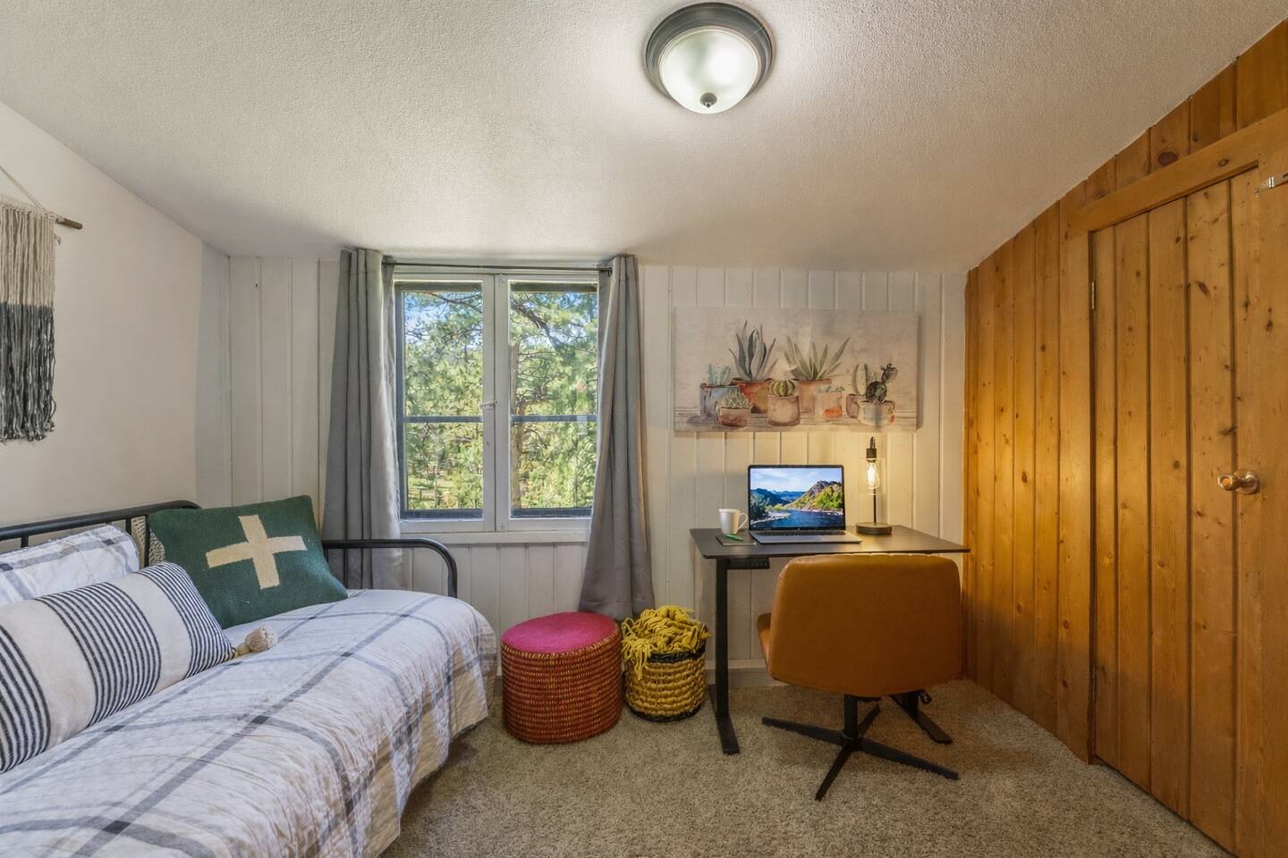 Office with a daybed and trundle, a desk and a chair