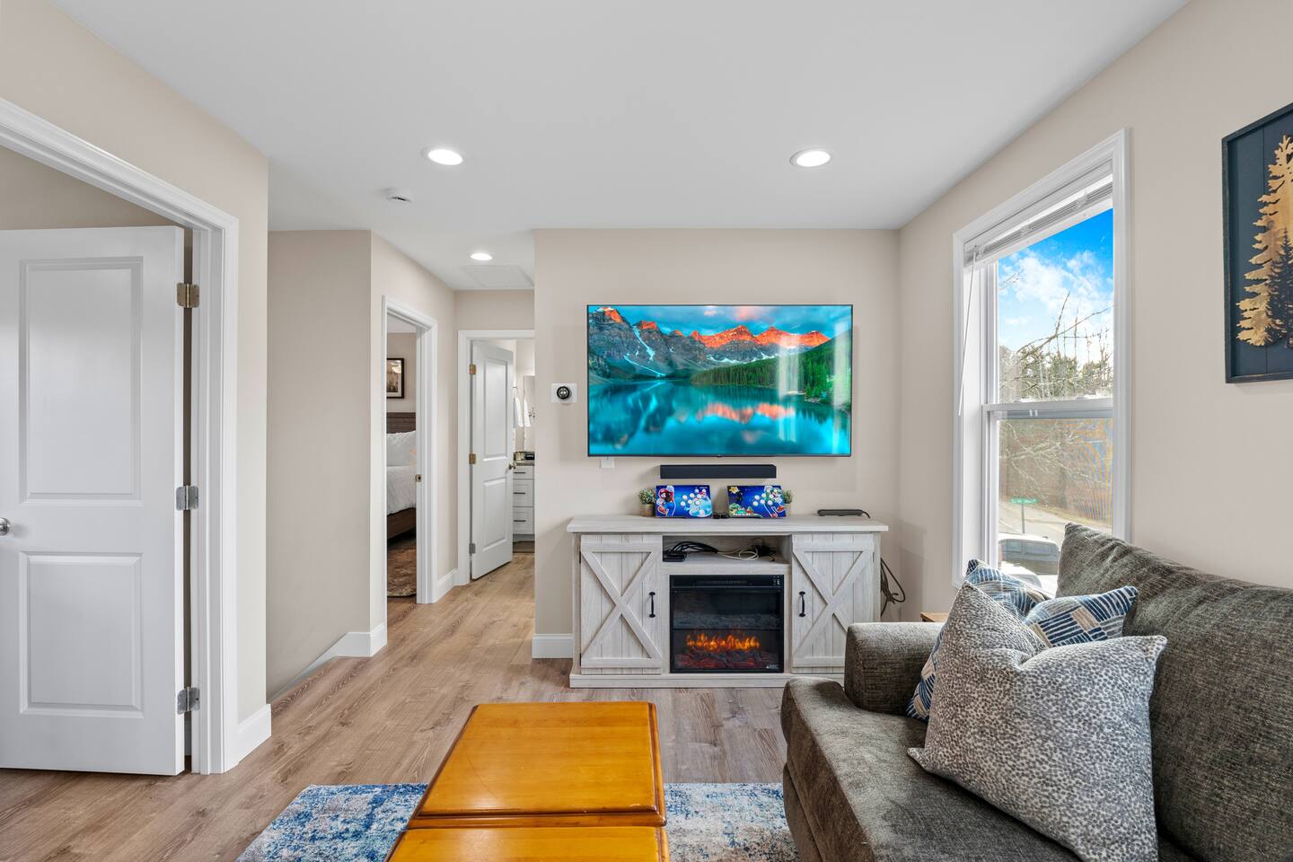 Second floor living. TV, Game system, board games, electric fireplace.