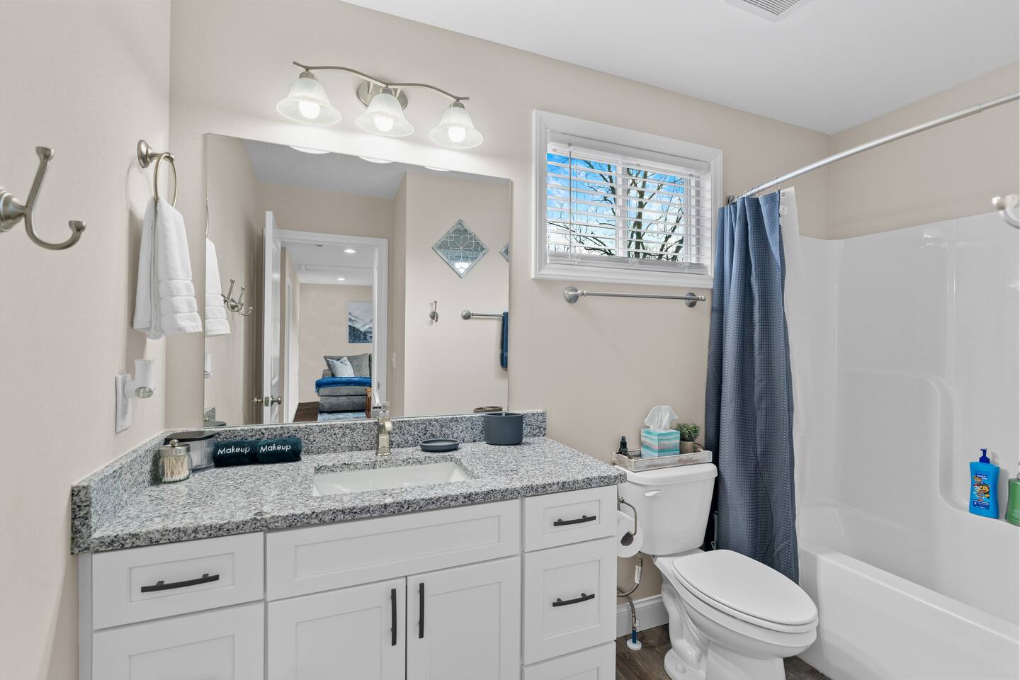 Full bathroom, shower and tub combo on second floor between two bedrooms and living room.
