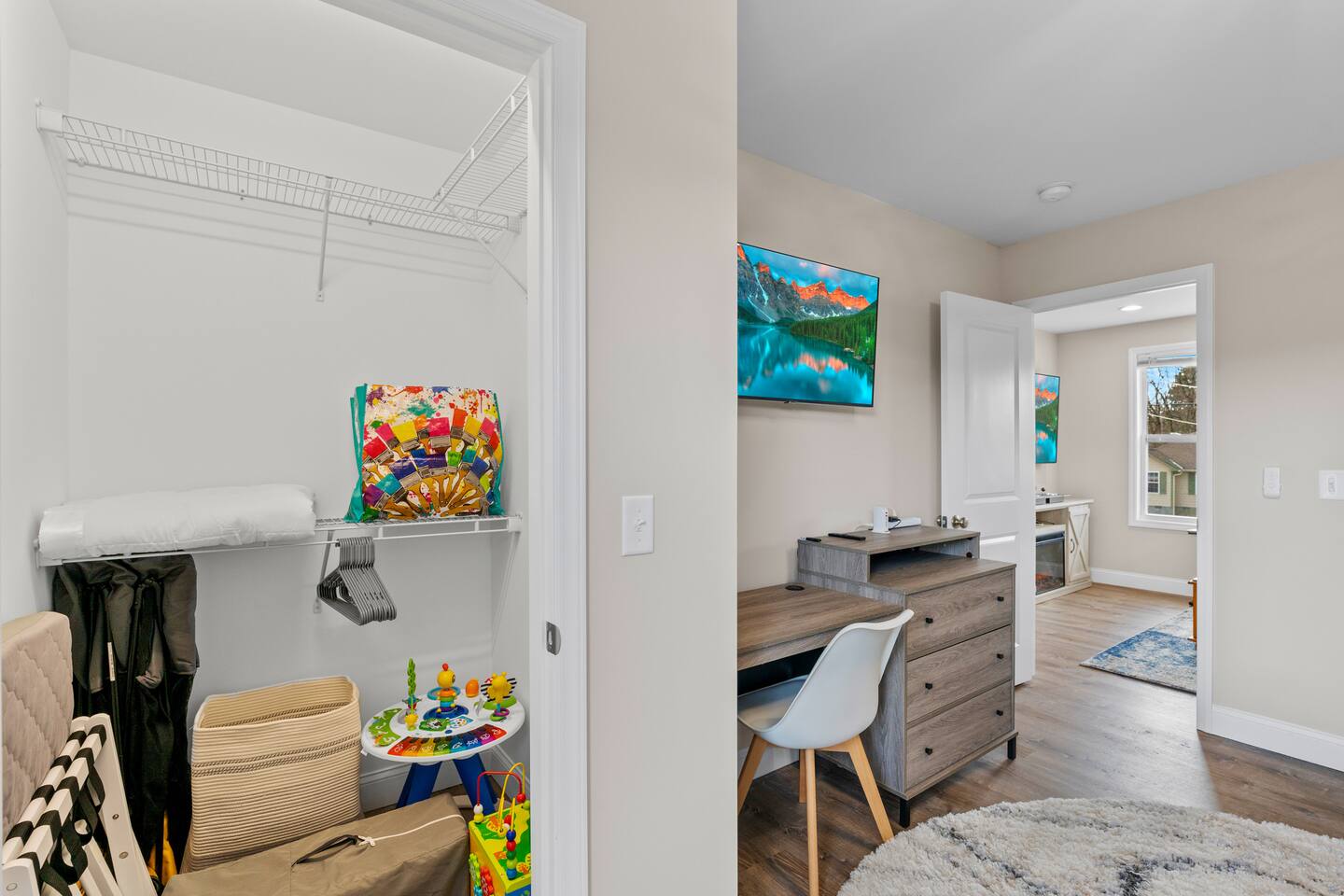 2nd Floor bedroom. 2x Full and 2x Twin sized beds. Closet full of kids toys, high chair, and pack and play. Office desk and chair. 43" TV