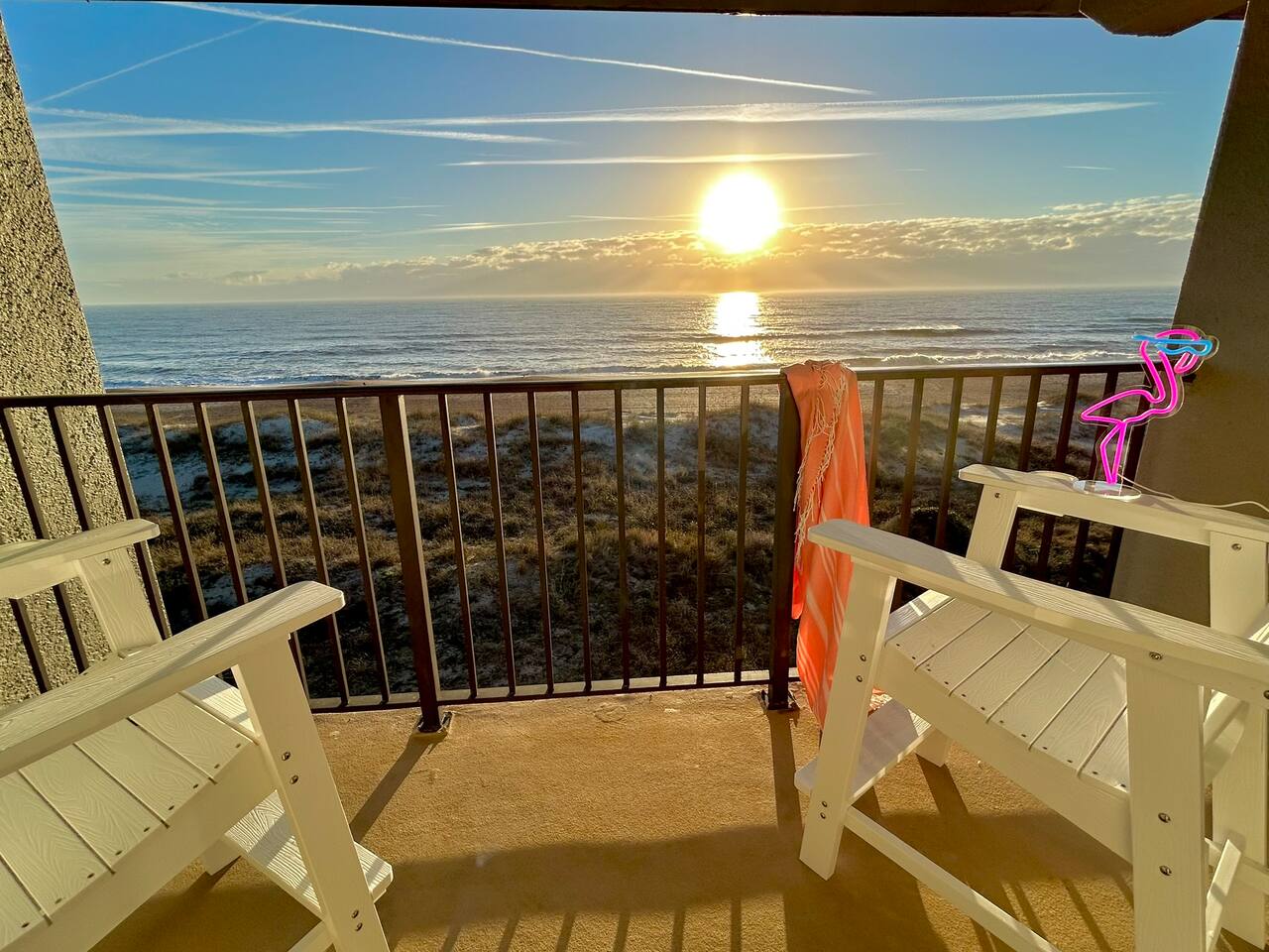 Balcony Bliss: Enjoy stunning ocean sunsets from your private retreat with stylish seating!