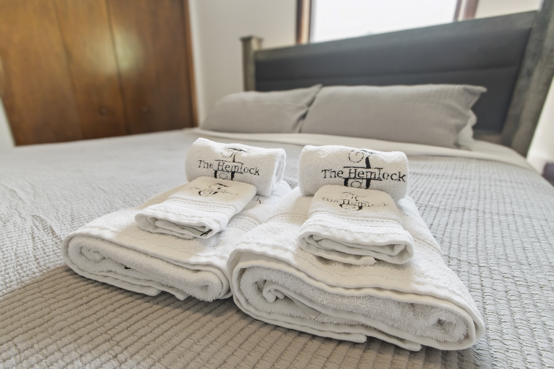 Fresh towels and a cozy, hotel-style bed for a restful stay