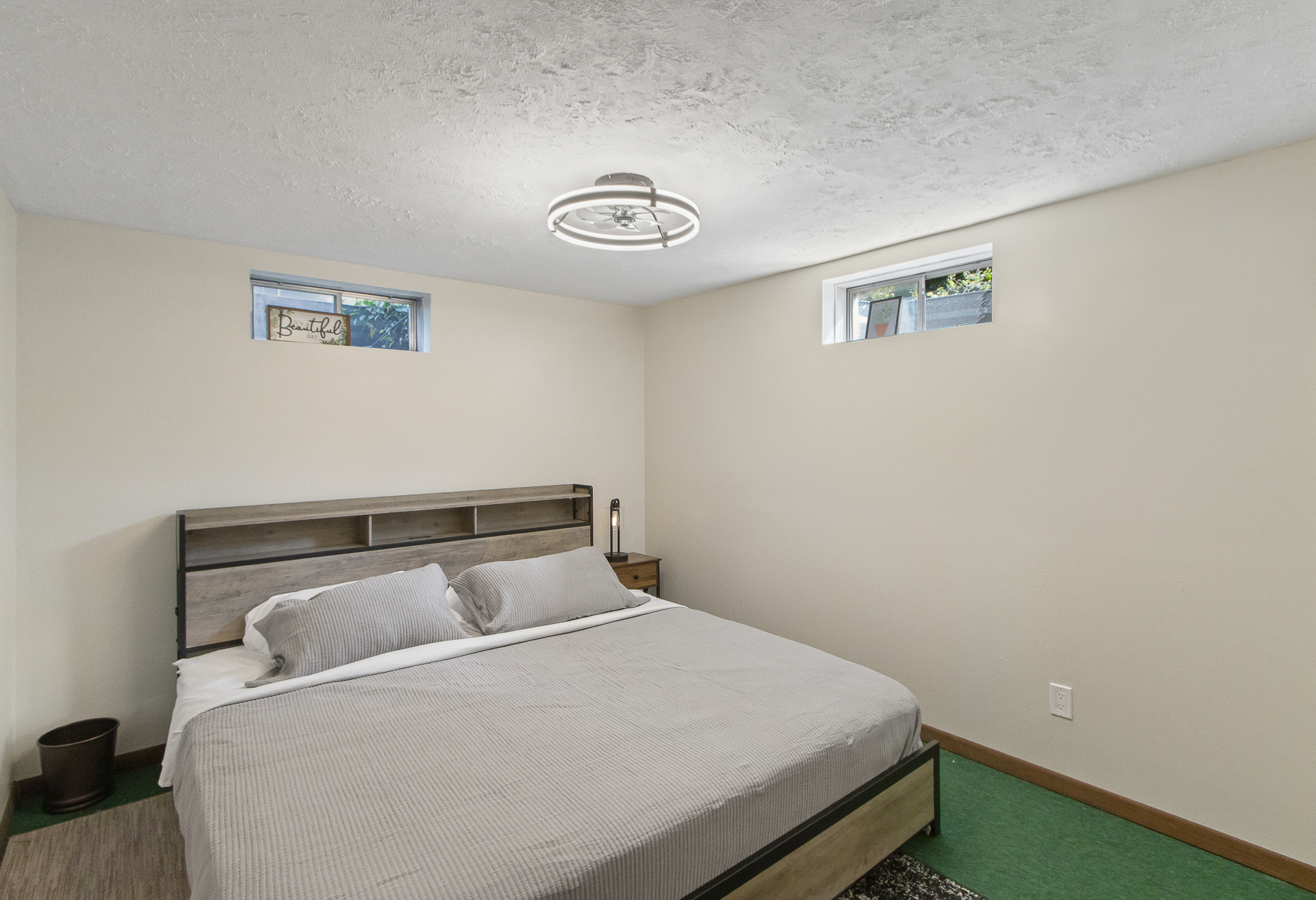 Cozy minimalist bedroom with king bed and natural light