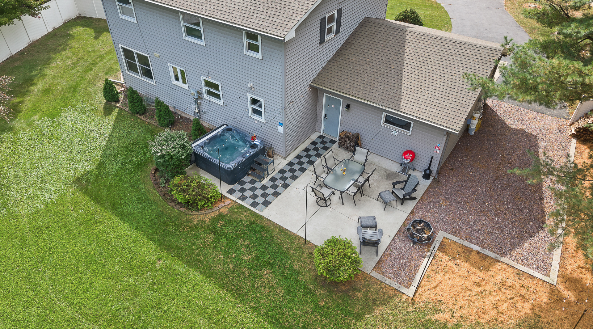 Private hot tub, fire pit, and spacious backyard patio retreat