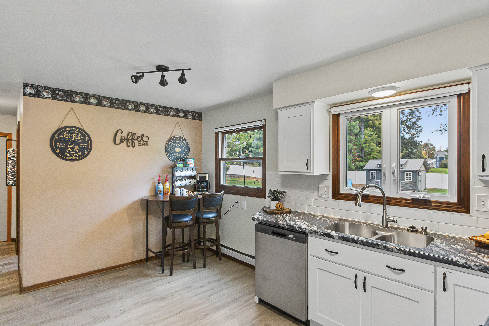 Bright kitchen with charming coffee bar and sunny window views