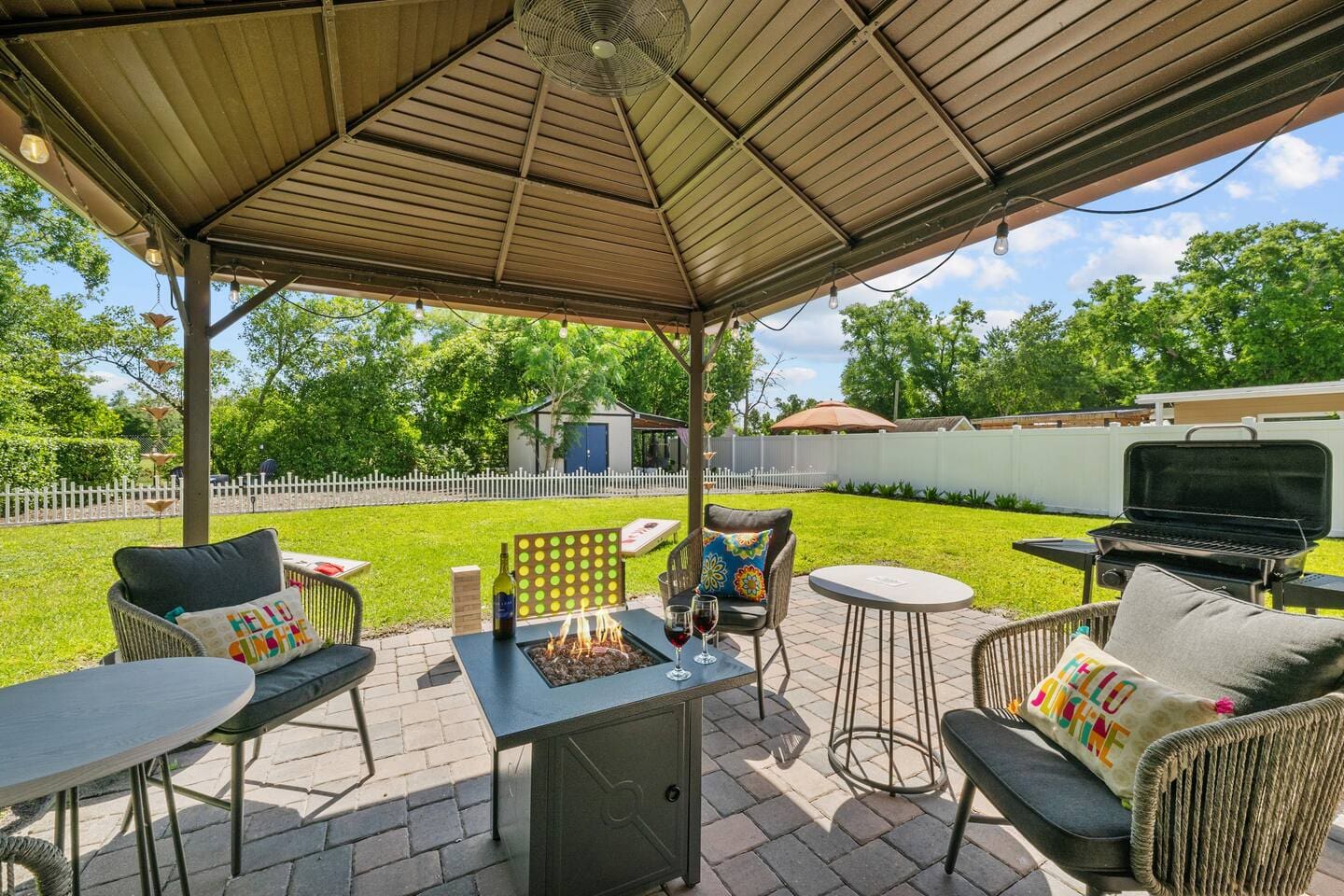 The back porch overlooking the fenced backyard
