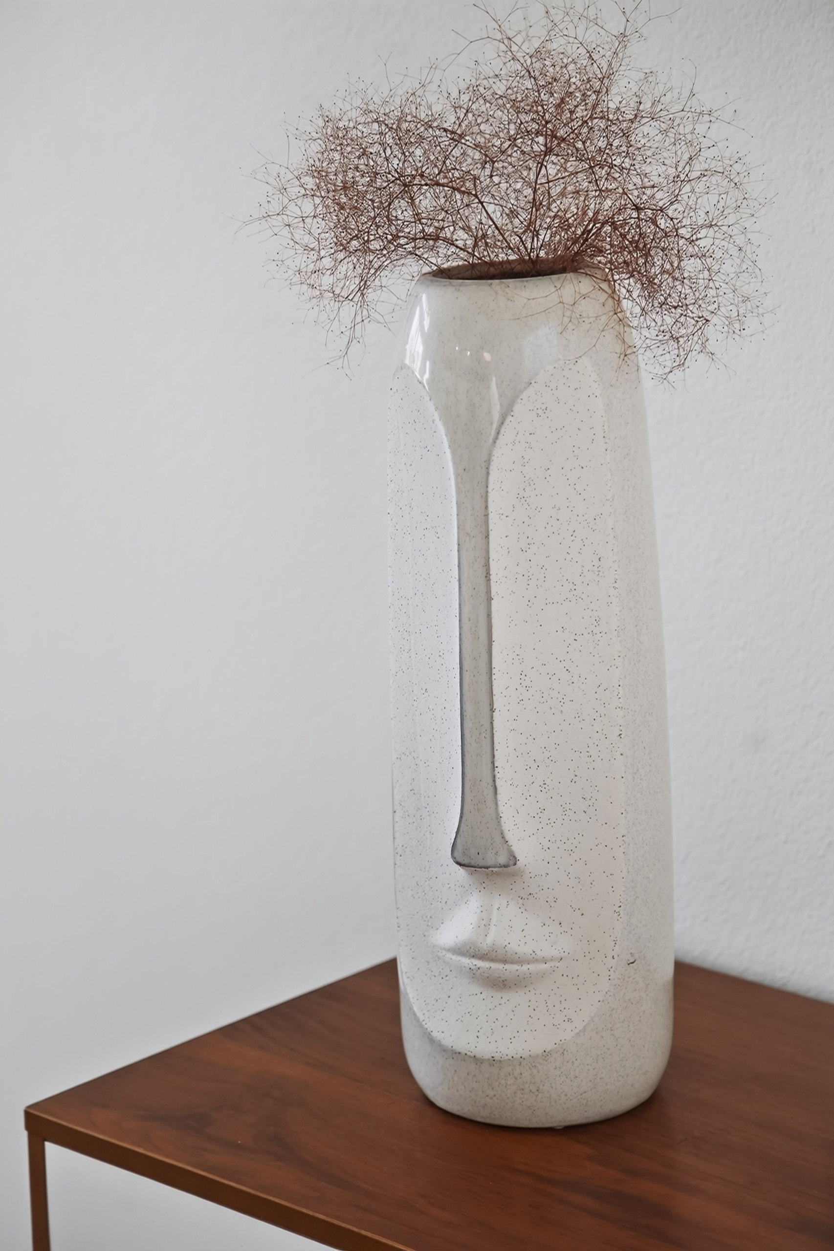 Modern sculptural vase styling adds an elegant, artistic touch