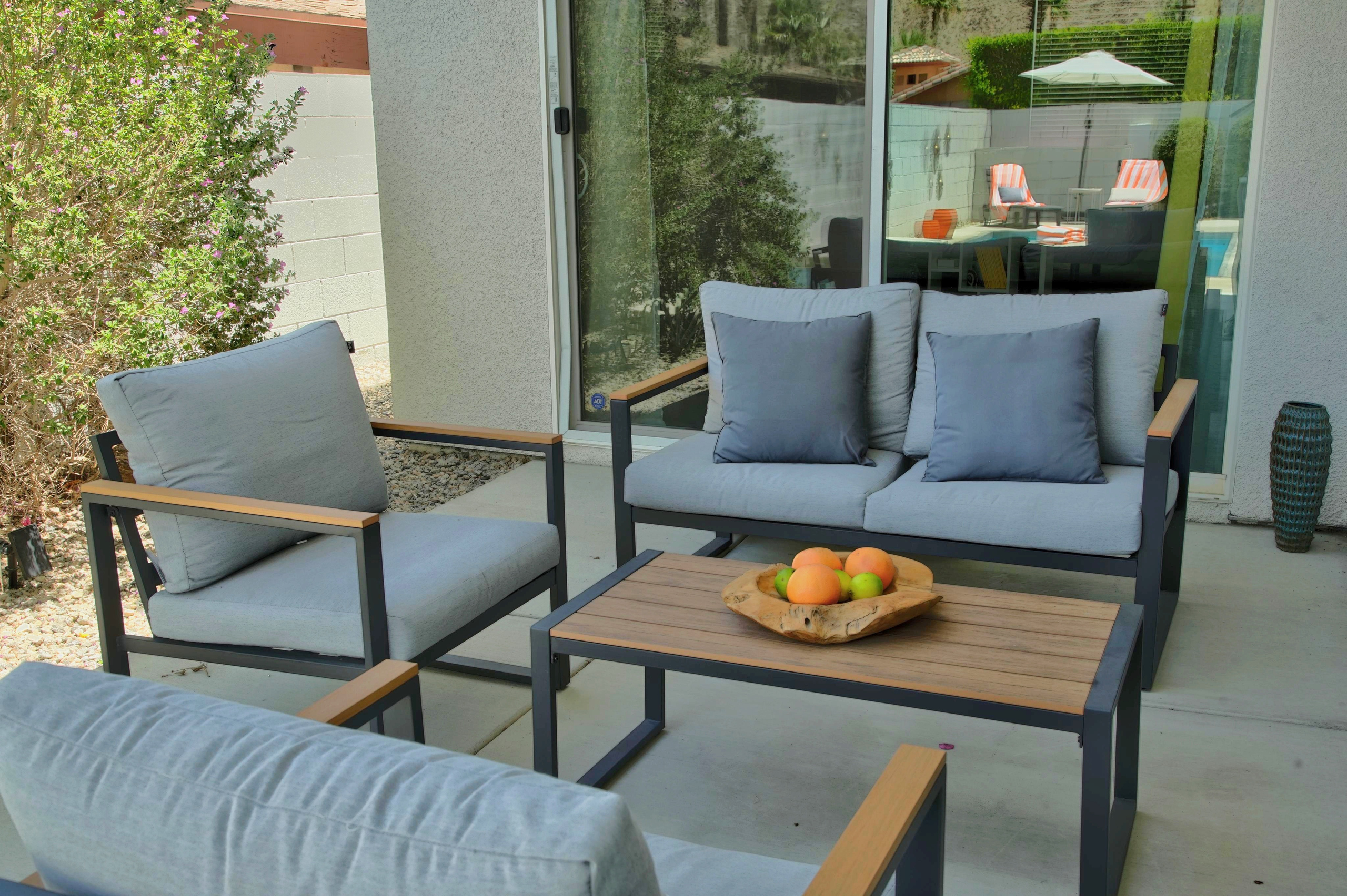 Modern private patio with comfy lounge seating and seamless indoor-outdoor flow