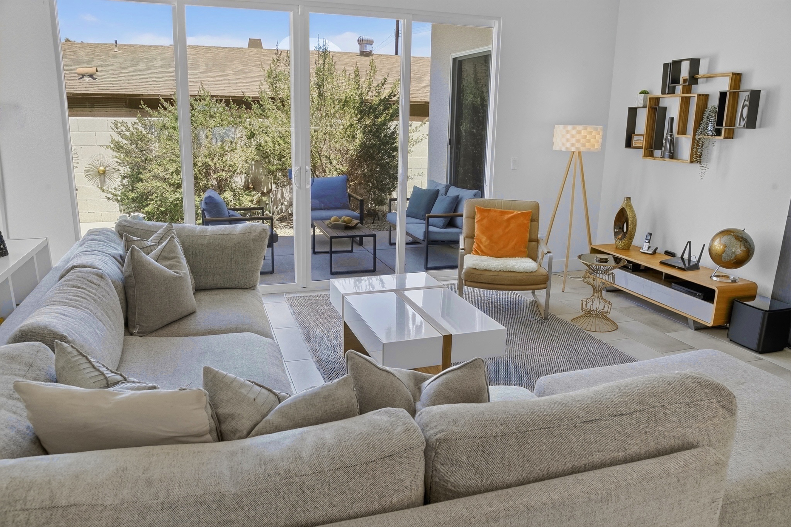 Bright modern living room with patio access and stylish lounge seating