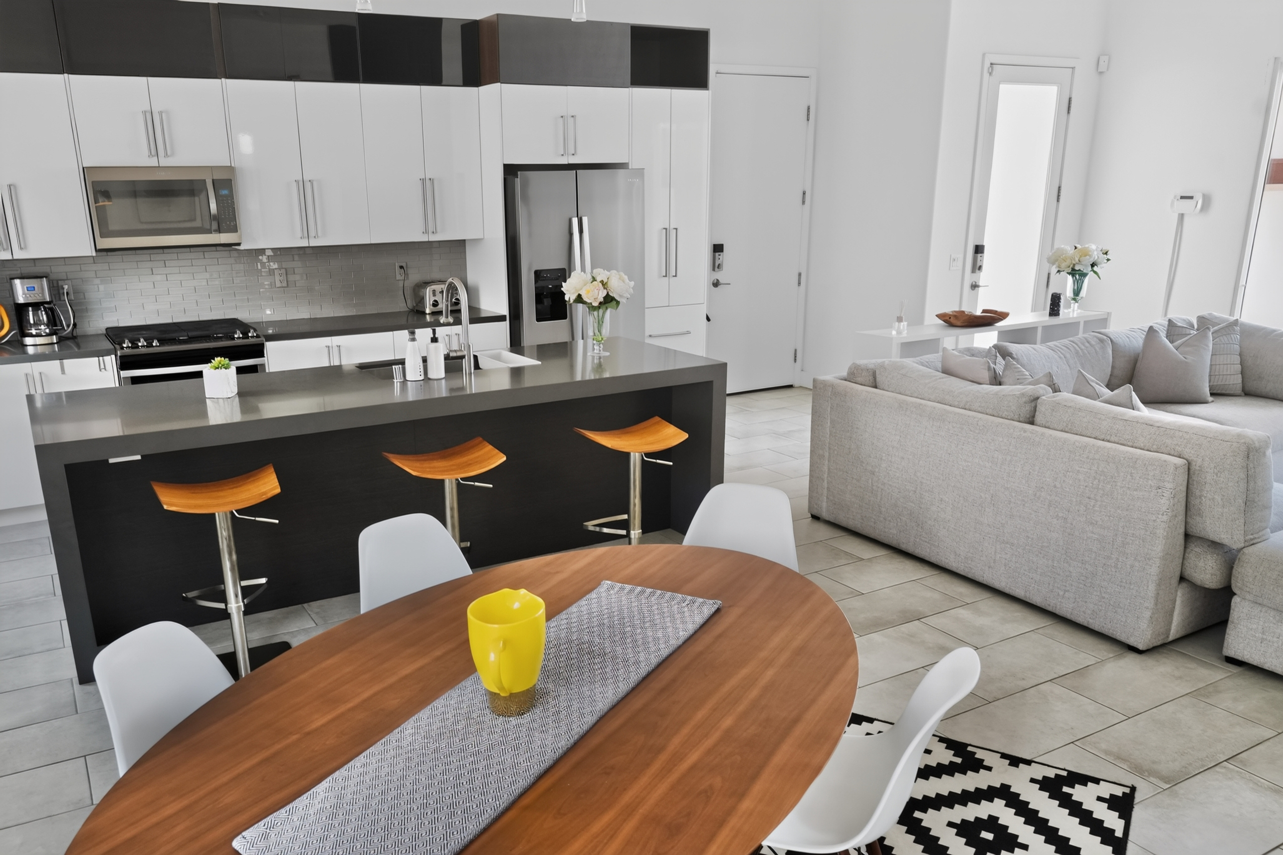 Bright open-concept kitchen and living area with island seating