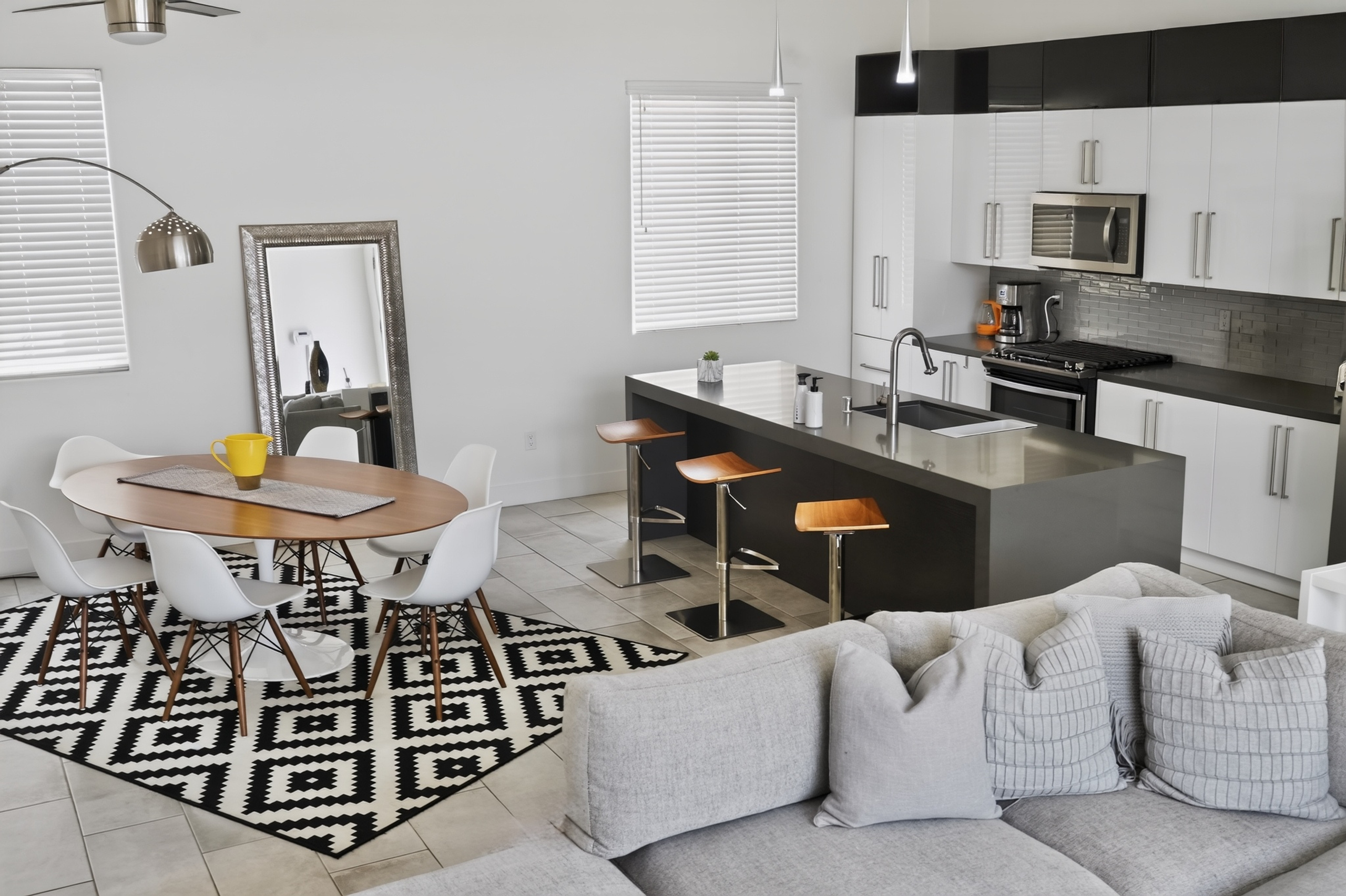 Bright modern kitchen with island seating and stylish dining area