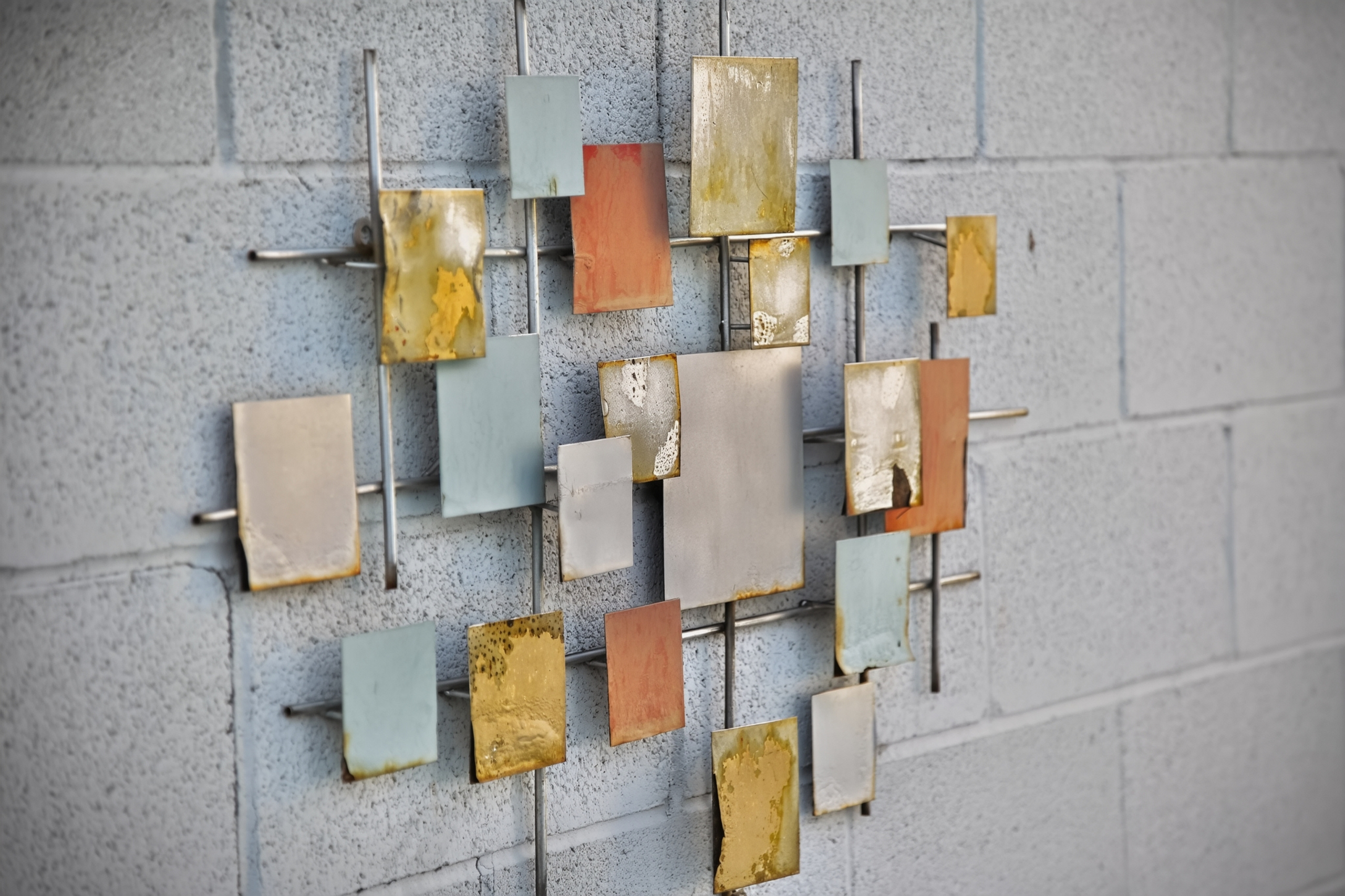 Modern mixed-metal wall art adds a chic, contemporary design touch