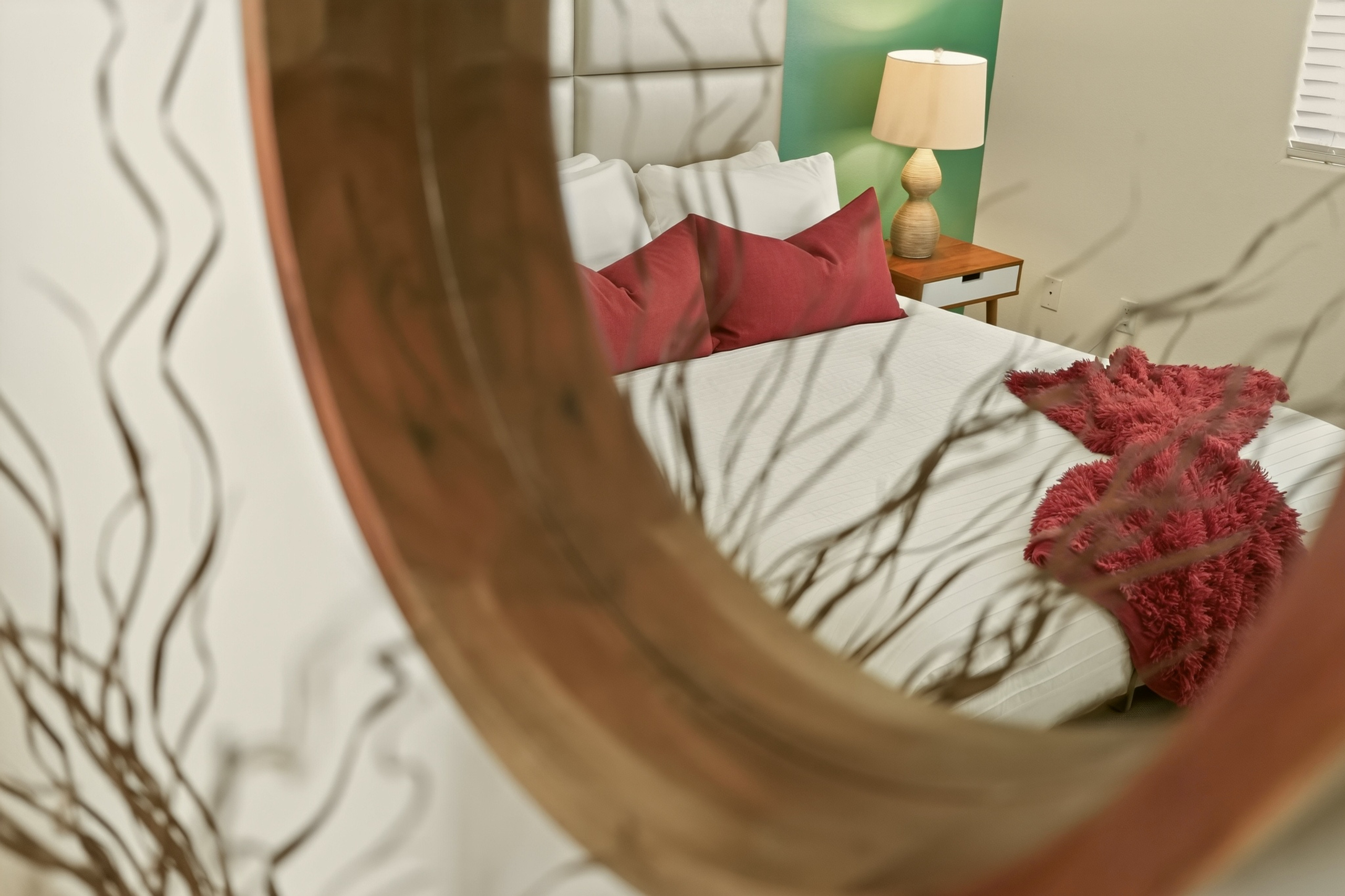 Cozy modern bedroom with plush bedding and warm designer touches