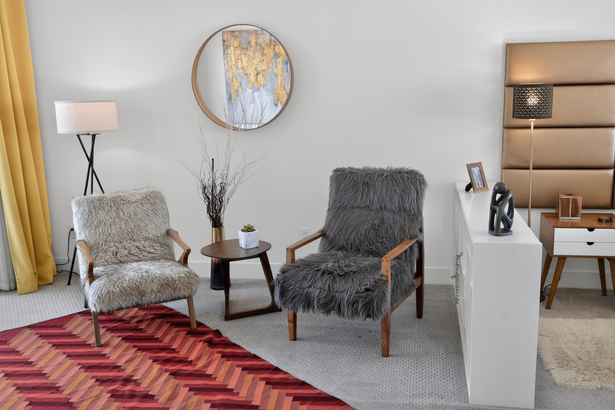 Cozy bedroom lounge with plush seating and chic modern decor
