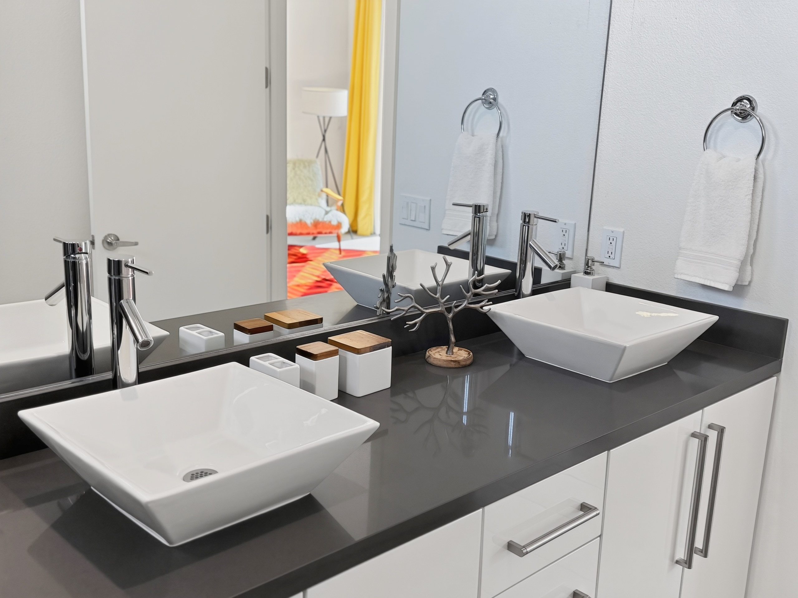 Modern double vanity with sleek vessel sinks and stylish finishes
