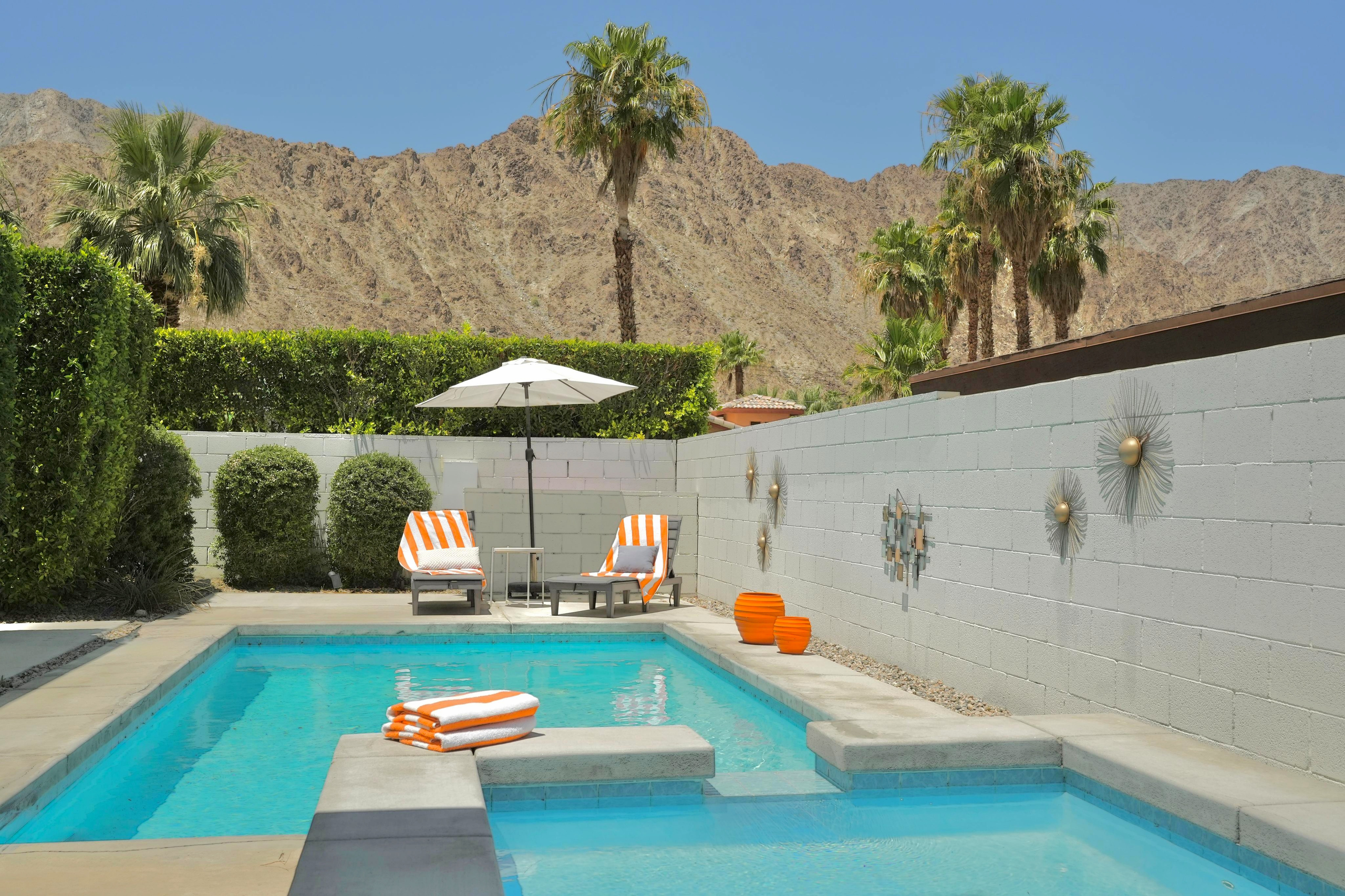 Private desert pool with mountain views and chic resort-style lounging