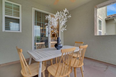 Relaxing Private Patio! ☀️☕ Enjoy dining al fresco on this covered patio with a stylish wooden dining set for four. It's the perfect spot for your morning coffee or an evening cocktail. Features a sliding glass door for easy indoor/outdoor access.
