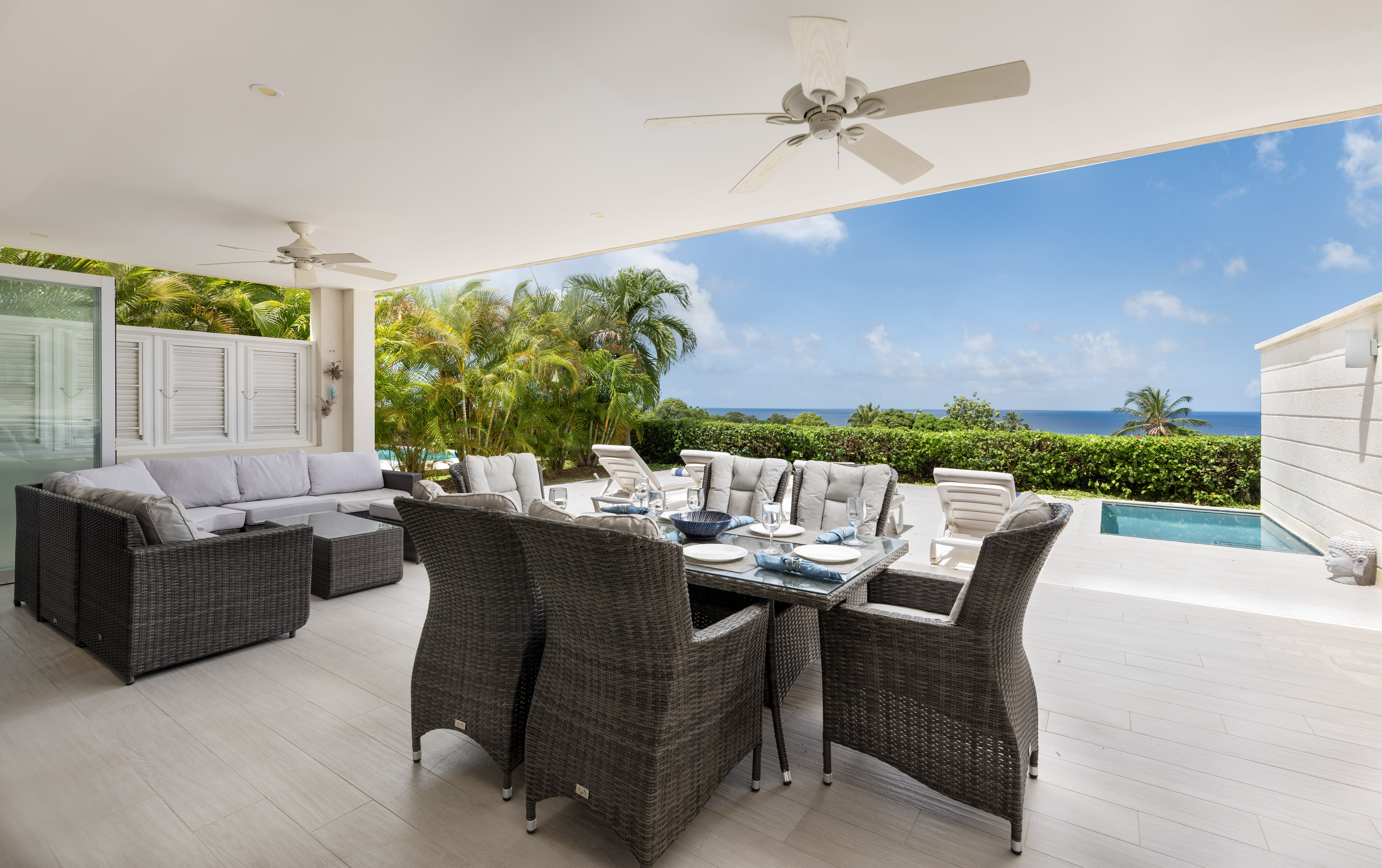 Covered ocean-view terrace with plunge pool and stylish outdoor dining