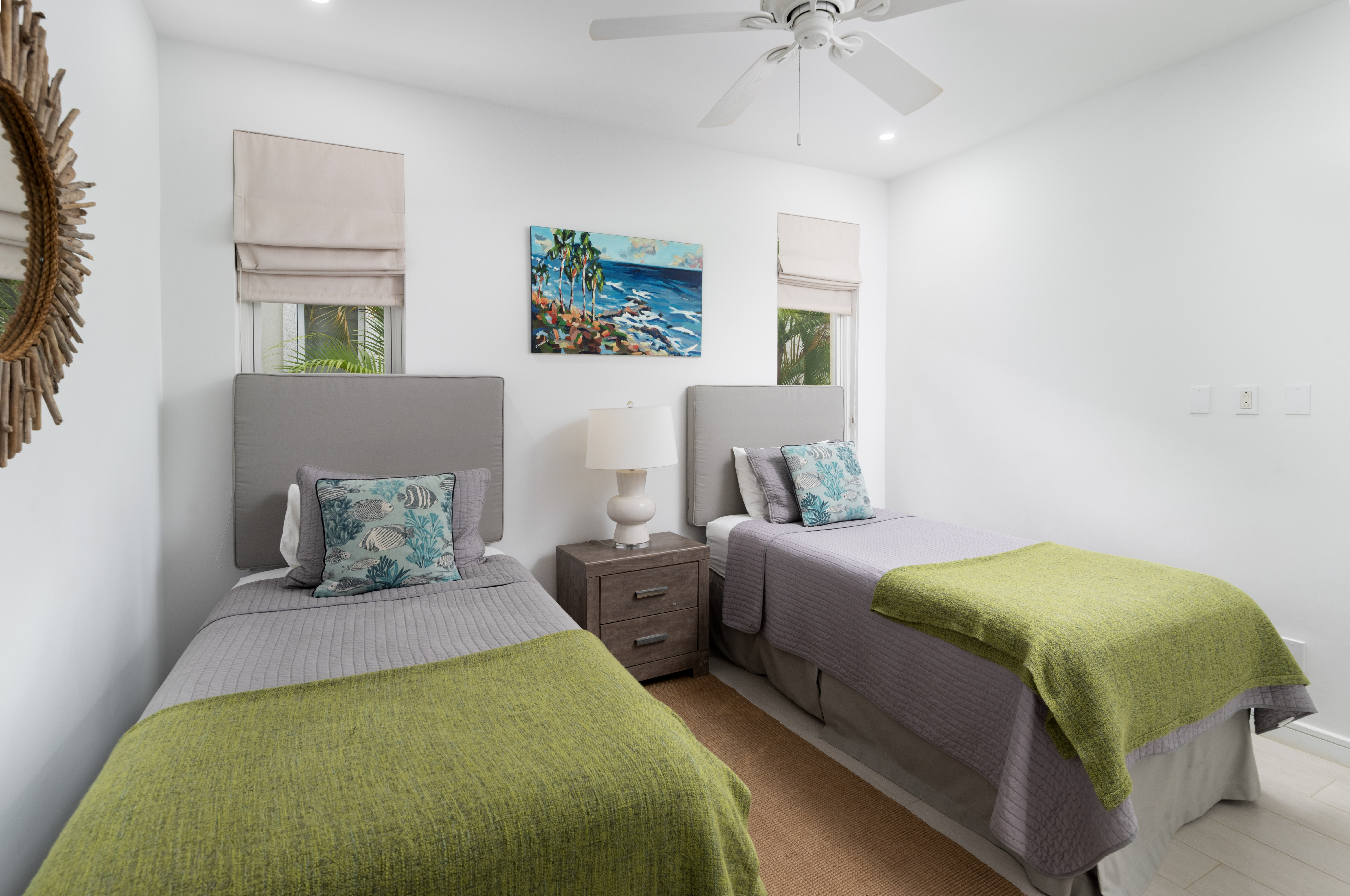 Bright twin bedroom with coastal decor and airy natural light
