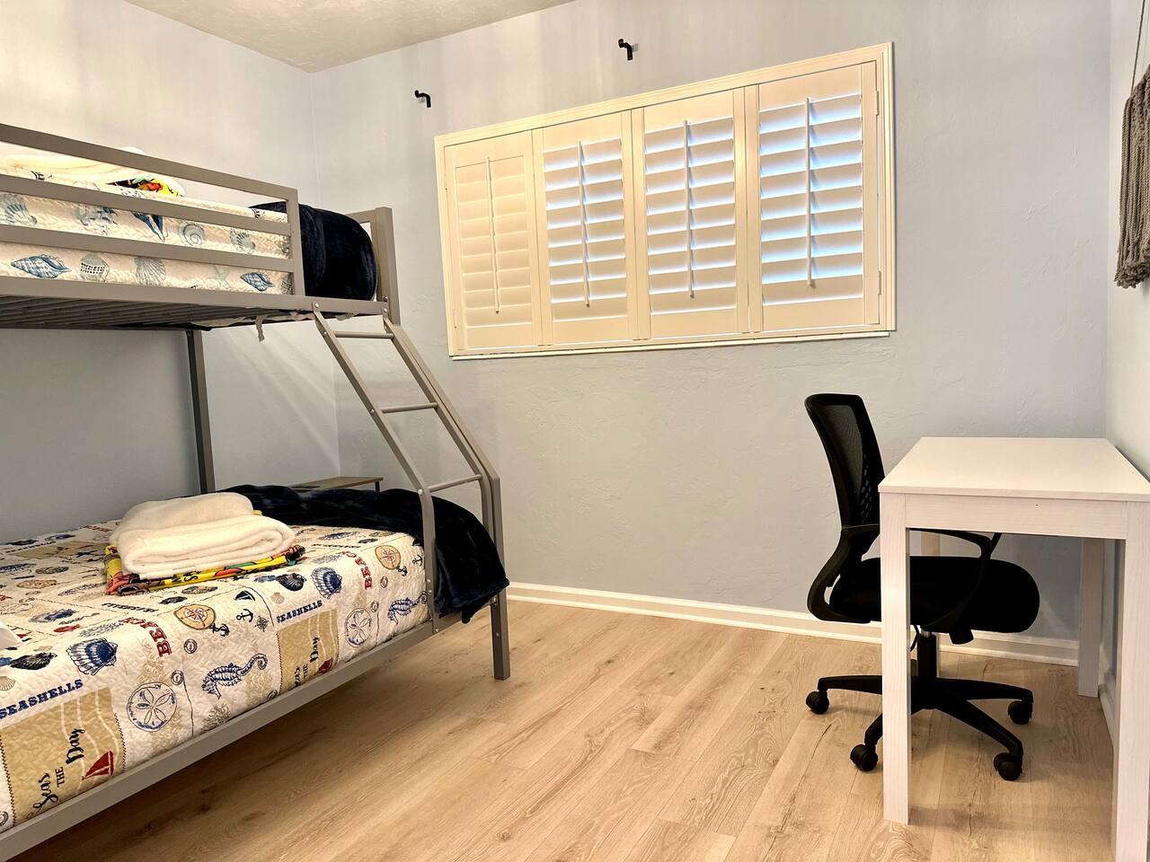 Bunk room with twin-over-full bunk and a desk
