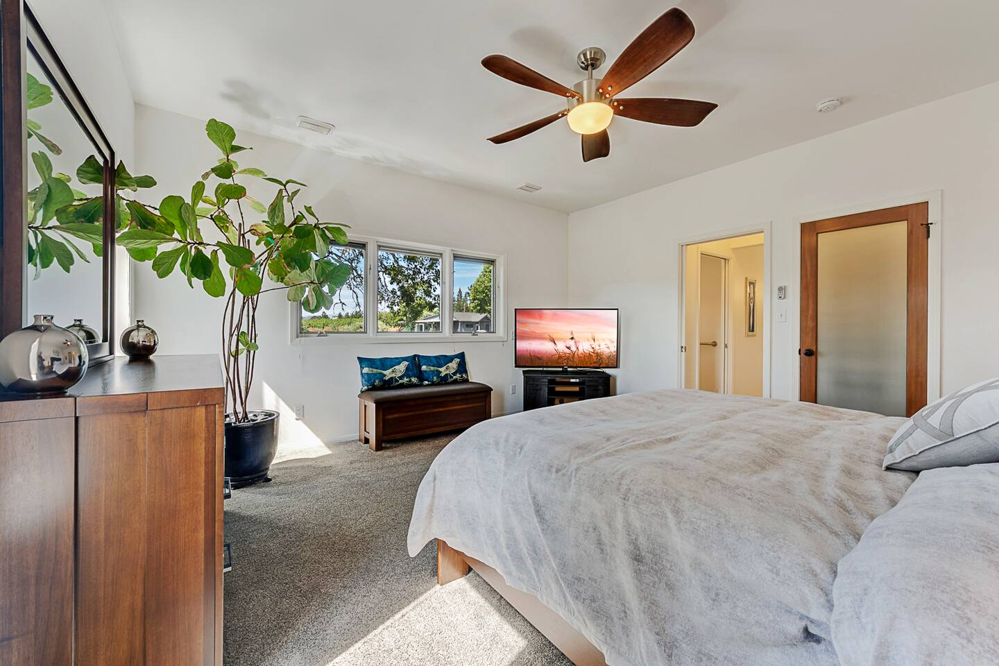 Catch up on your favorite shows after a long day in the comfort of our upstairs primary bedroom.