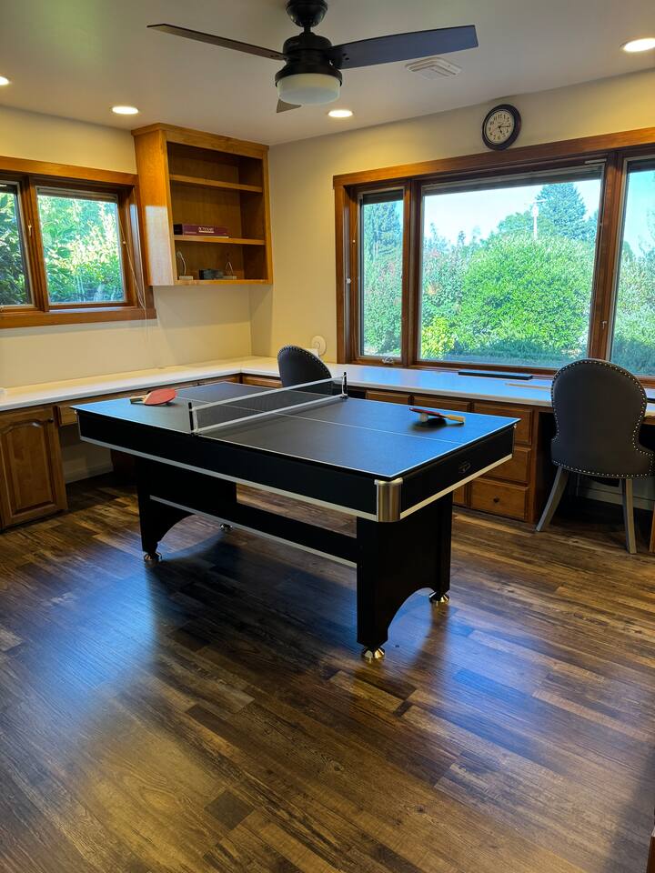Our versatile game room, den, and office space offers stunning views and the perfect balance of fun and functionality. Enjoy a dedicated workspace, play pool or ping pong, or simply unwind—all in one comfortable and stylish setting.