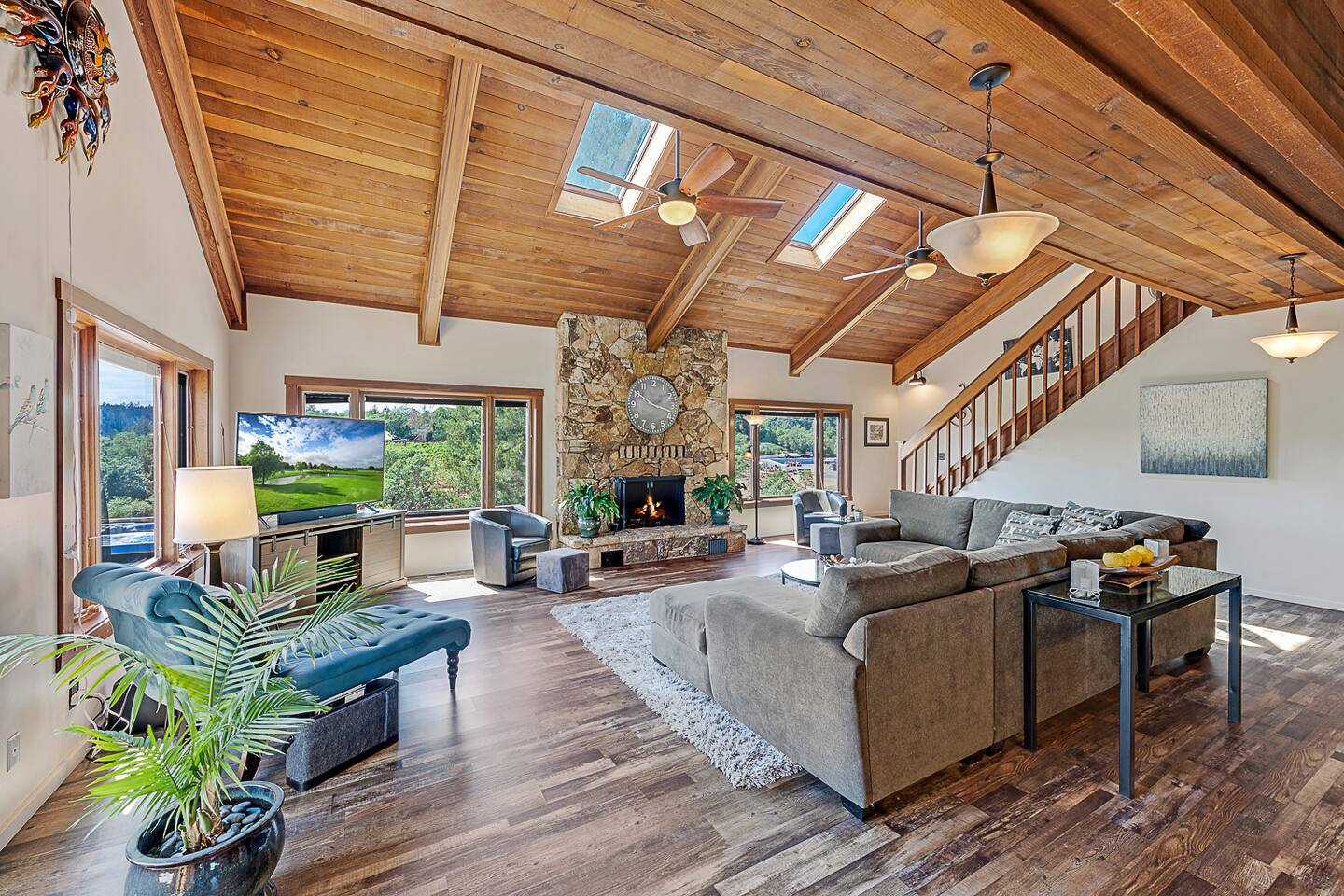 Enjoy the perfect blend of comfort and elegance in our living room. With a large couch, smart TV, and stunning views of rolling hills, plus an indoor fireplace for added coziness, it's ideal for both relaxation and entertainment