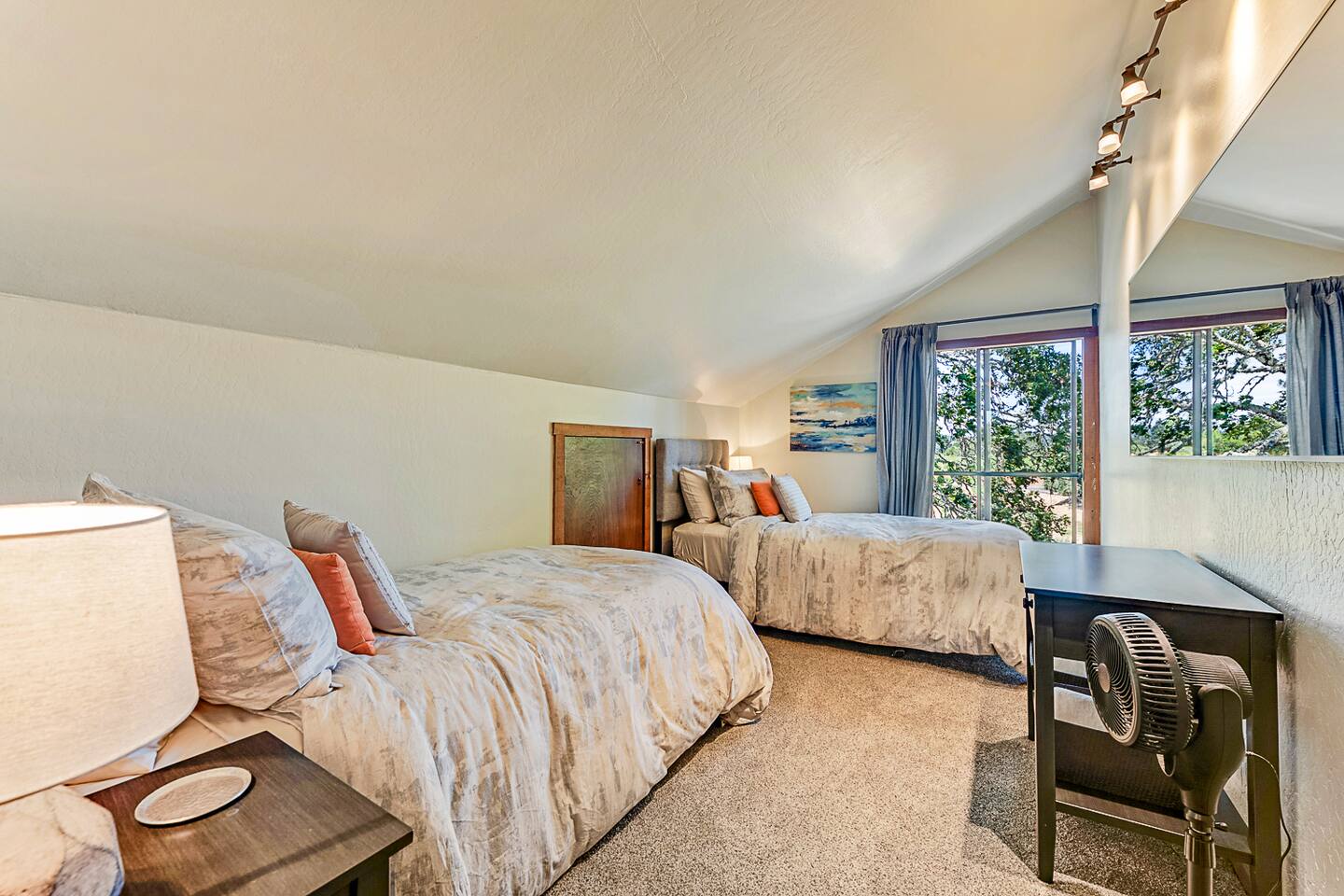 This versatile bedroom offers a twin XL or king option, ideal for kids or couples. Enjoy abundant natural light and stunning views from the window, making it a perfect space for both restful nights and daytime relaxation.